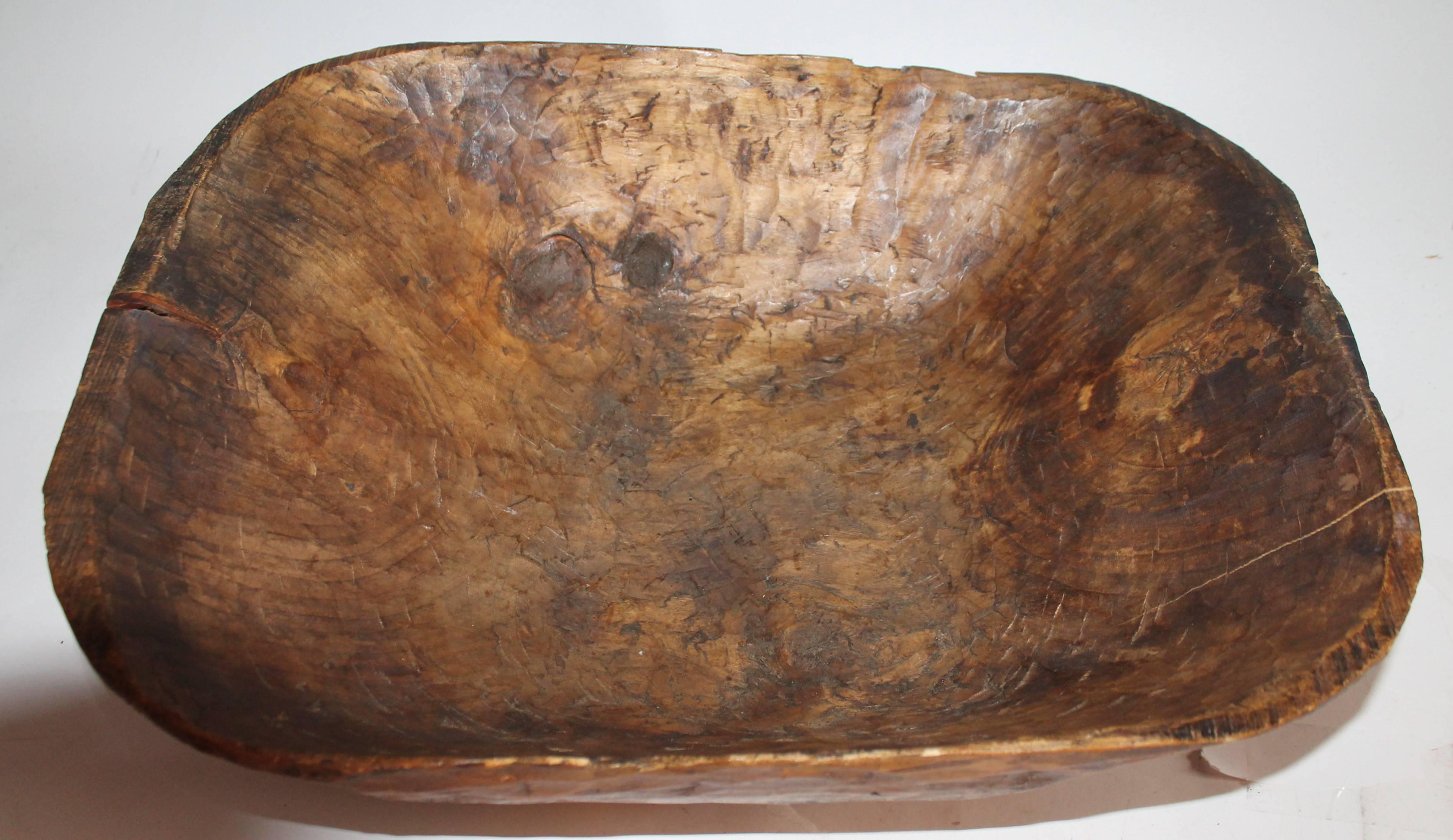 This fine American dough bowl was found in Kentucky and is in Fine as found condition. There is a minor tiny split or repair on the top edge of the bowl. This is such a unusual shape and size. Great serving or fruit bowl in a very deep size.