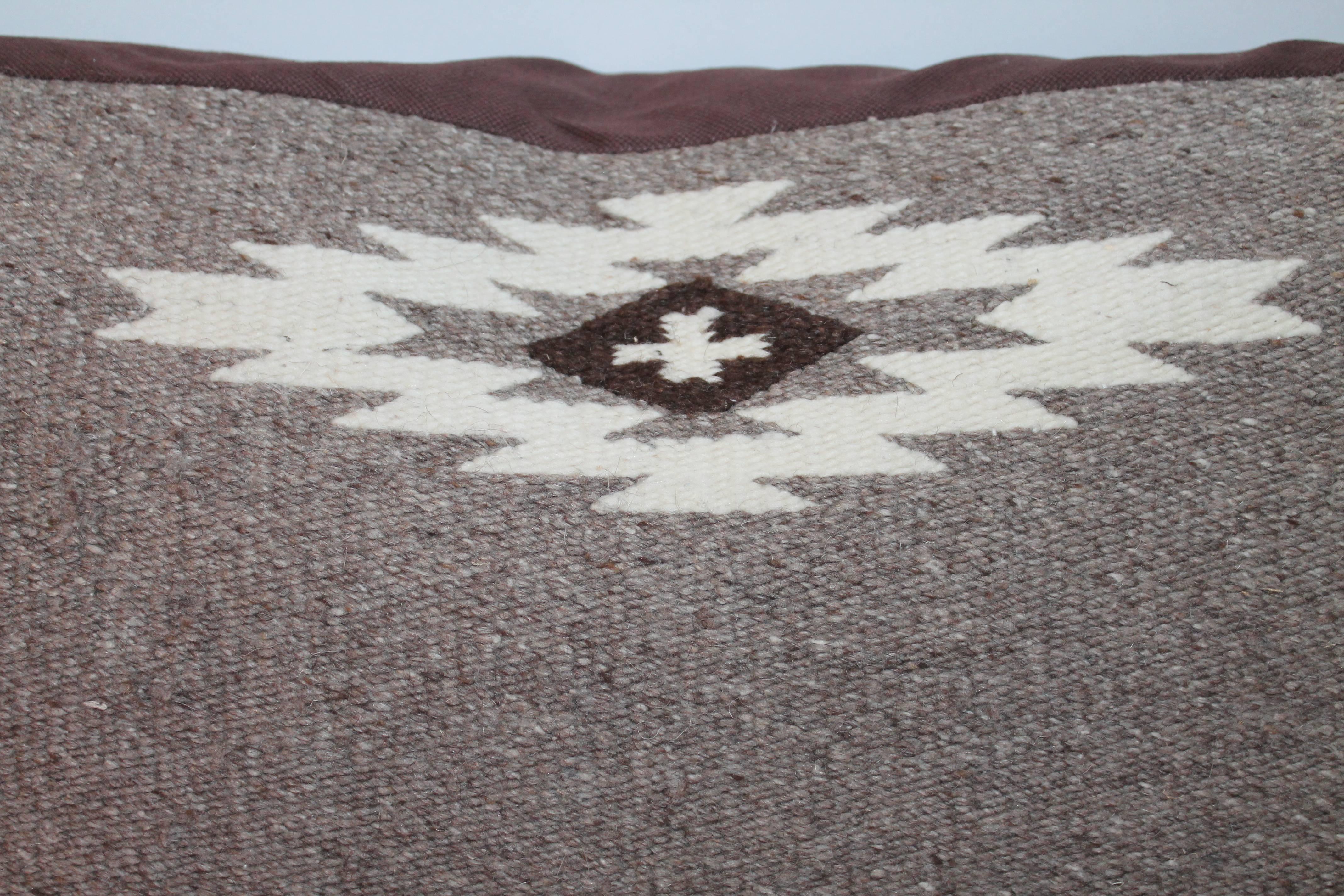 This handwoven Indian weaving pillow has arrows and somber colors. The condition is very good.