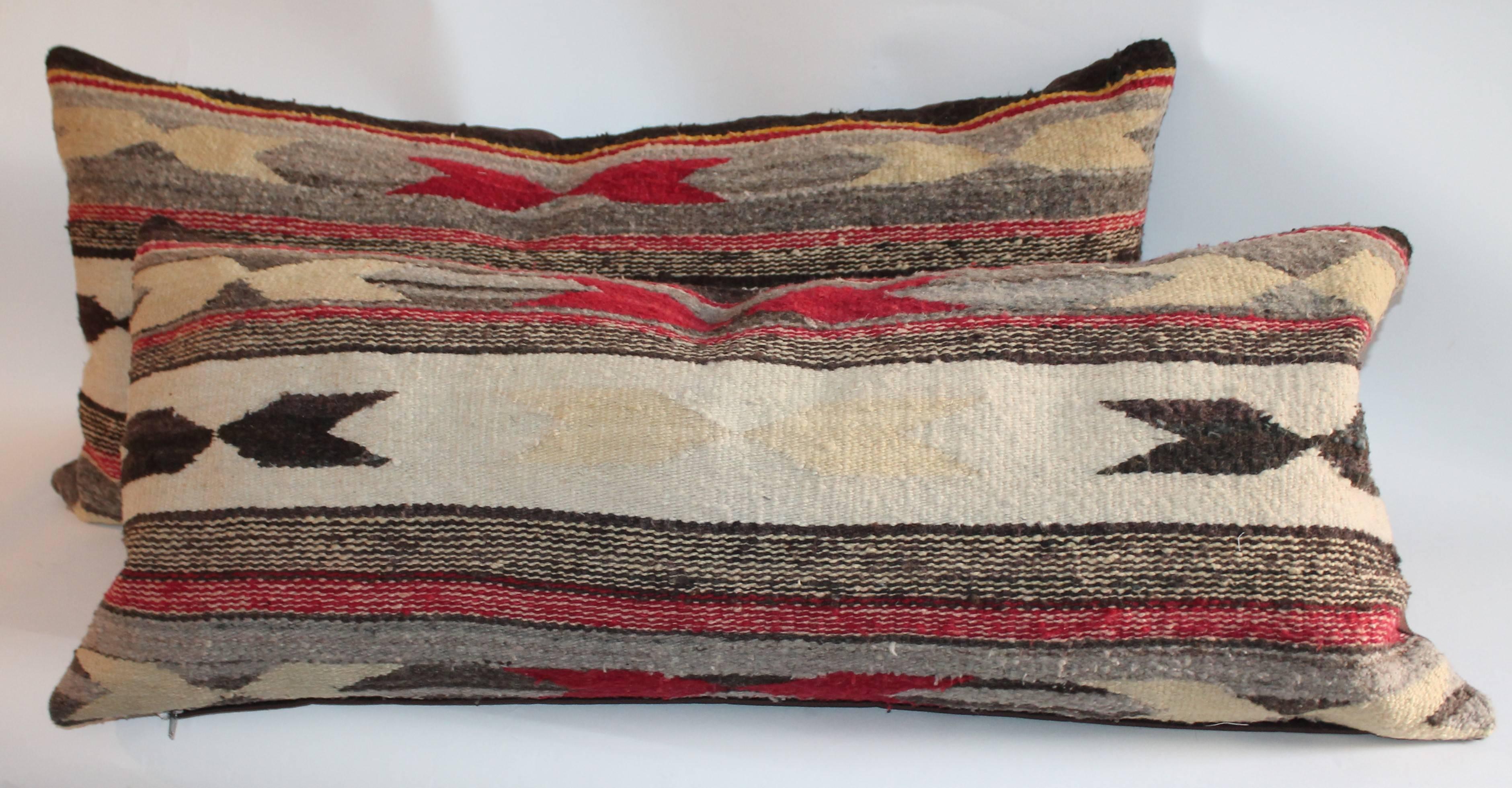 These Navajo Indian weaving bolster pillows have three color and chevron pattern. The backing is in a brown cotton linen.
Large pillows is 16 x 38 / small pillow 15 x 37 / each bolster is $950.00 / 1695.00.