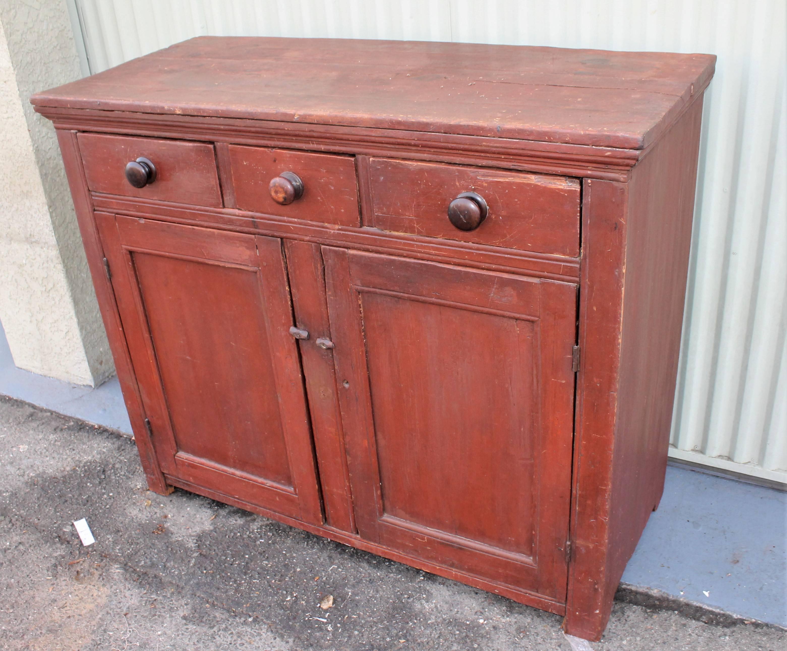 This original red painted jelly cupboard with original three drawers over two doors. The condition is very good.