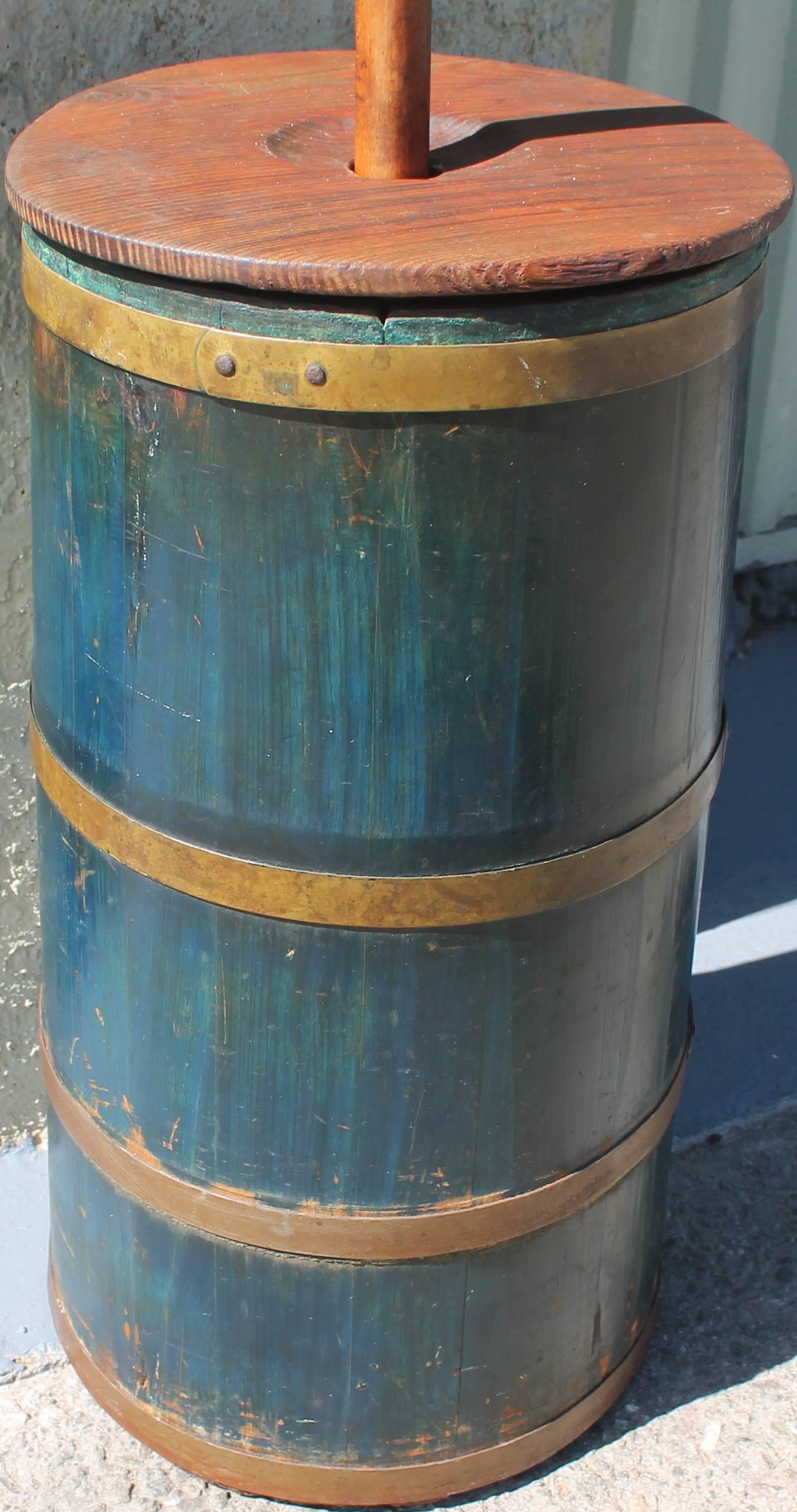 This is a spectacular handmade butter churn that was found on a farm in Illinois. The dark blue paint is wonderful. It has the original stomper inside. Great old patina!
