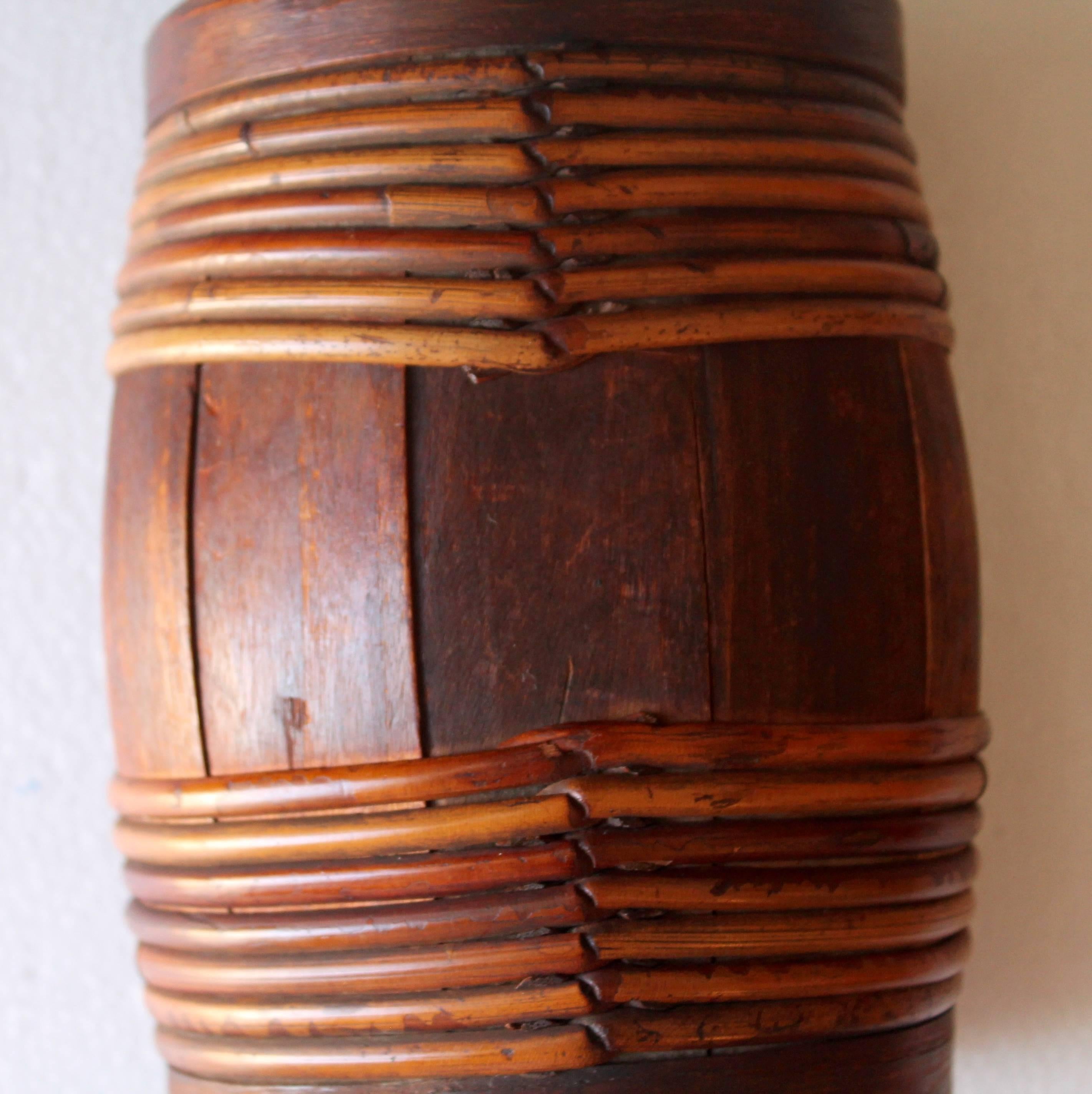 This wonderful New England is all wood and has several wood band wraps. The lid is even hand-carved wood. The condition is very good.