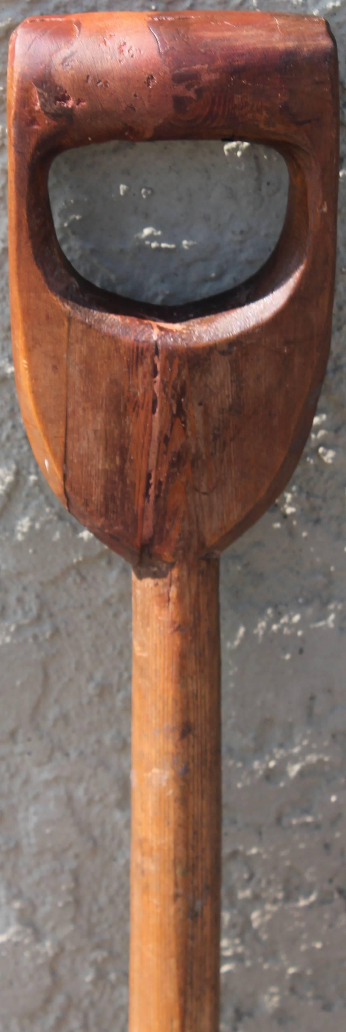 This fine original red painted hand-carved pine shovel was found in New England. The patina is the best. Condition is very good and it does have a lot of nice age wear.