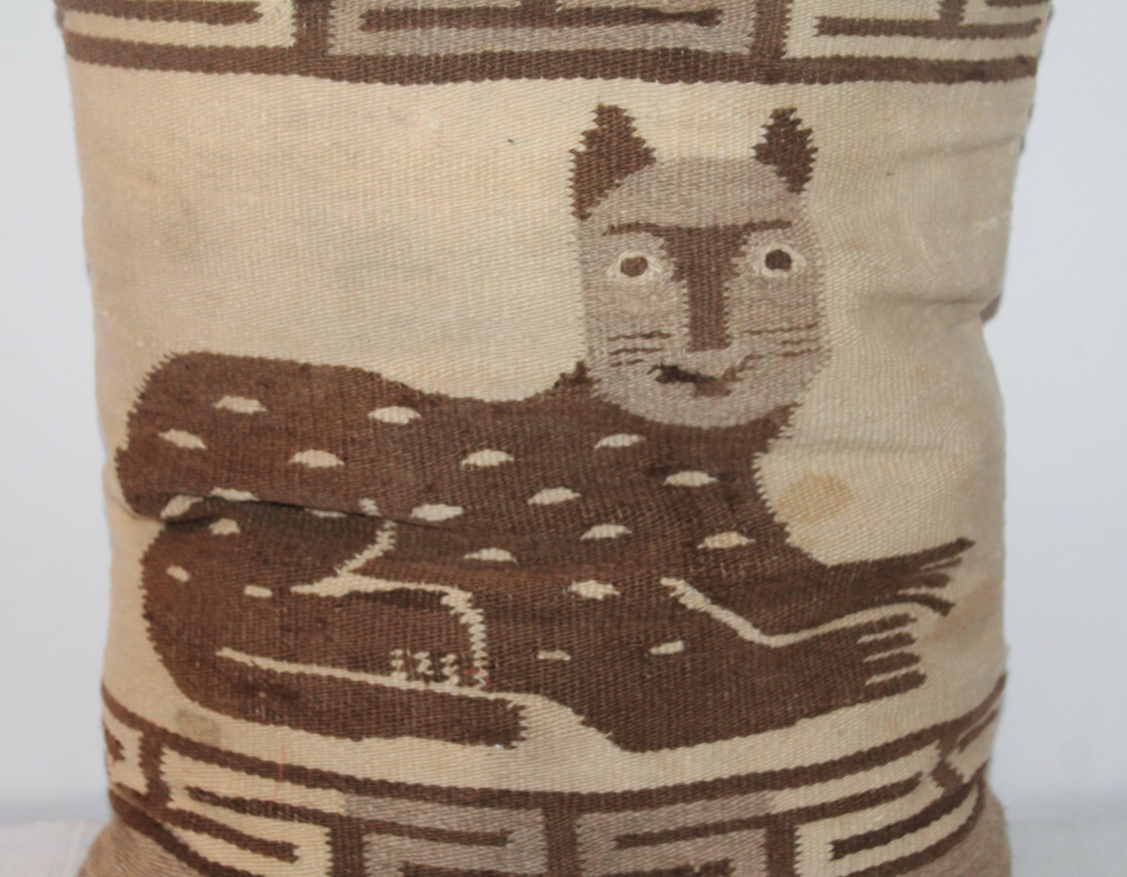 This large amazing handwoven Indian weaving cat pillow is so folky and looks very Americana. This is quite rare for an Indian weaving. The condition is good with minor spots consistent with age and use. The backing is in a tan cotton linen. The