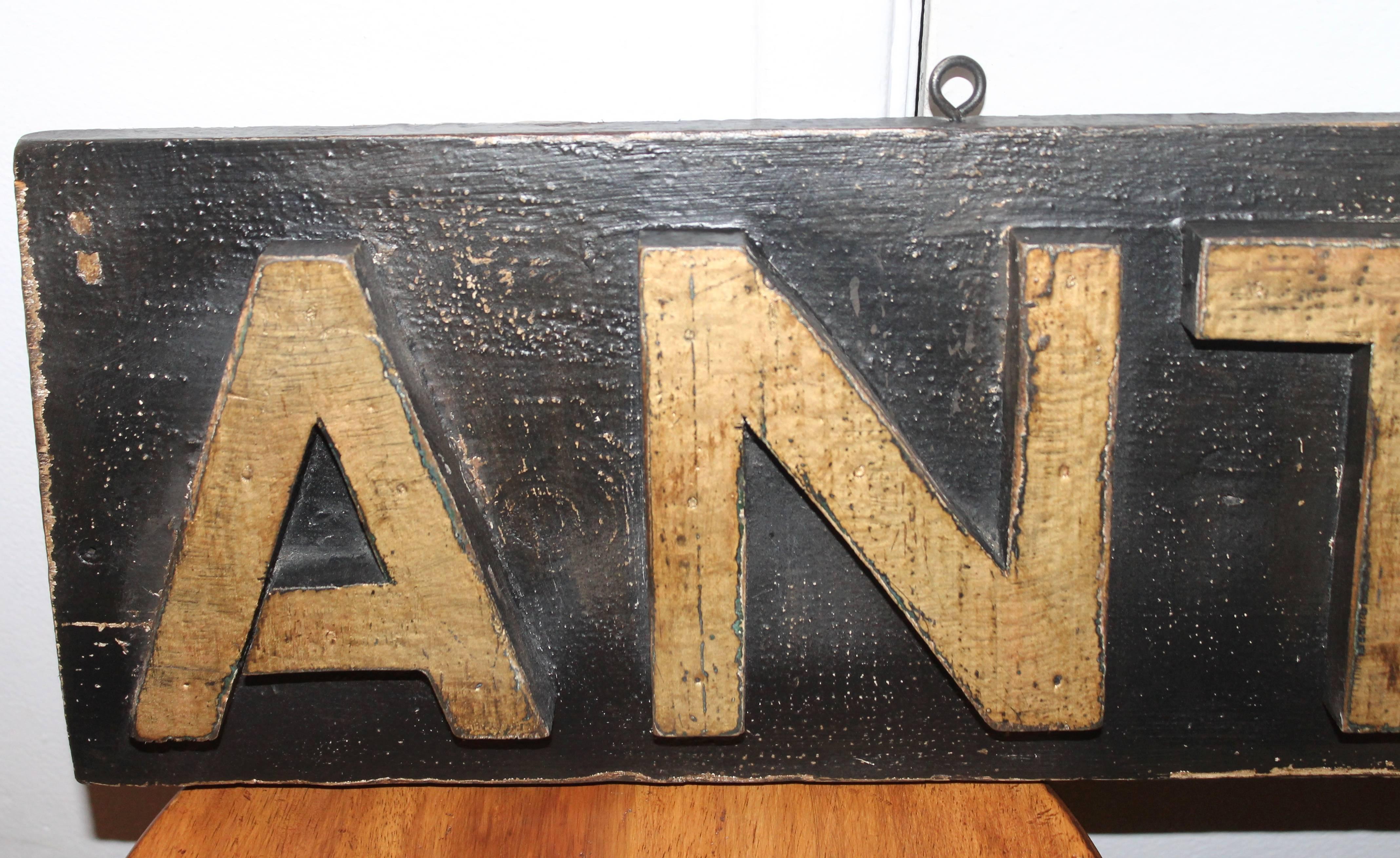 This very cool hand-carved and painted antiques trade sign is in wonderful as found condition. The painted surface is original and wear is consistent with age and use. It is ready for hanging with eye hooks on top of sign. The patina is the very
