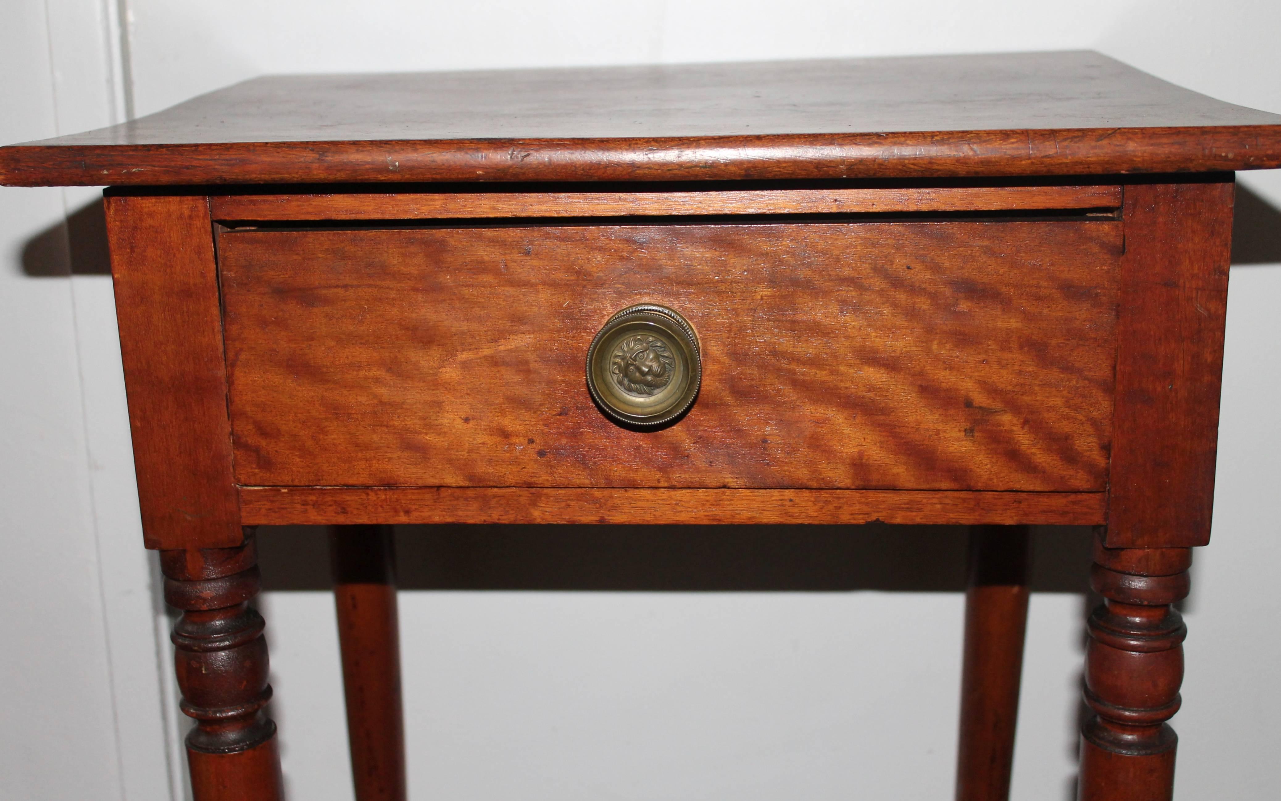 This wonderful walnut one drawer stand has a great old patina with original brass drawer pull. The drawer is dove tailed and square nailed construction. The condition is very good and sturdy. Wonderful original surface. Was found on a ranch in