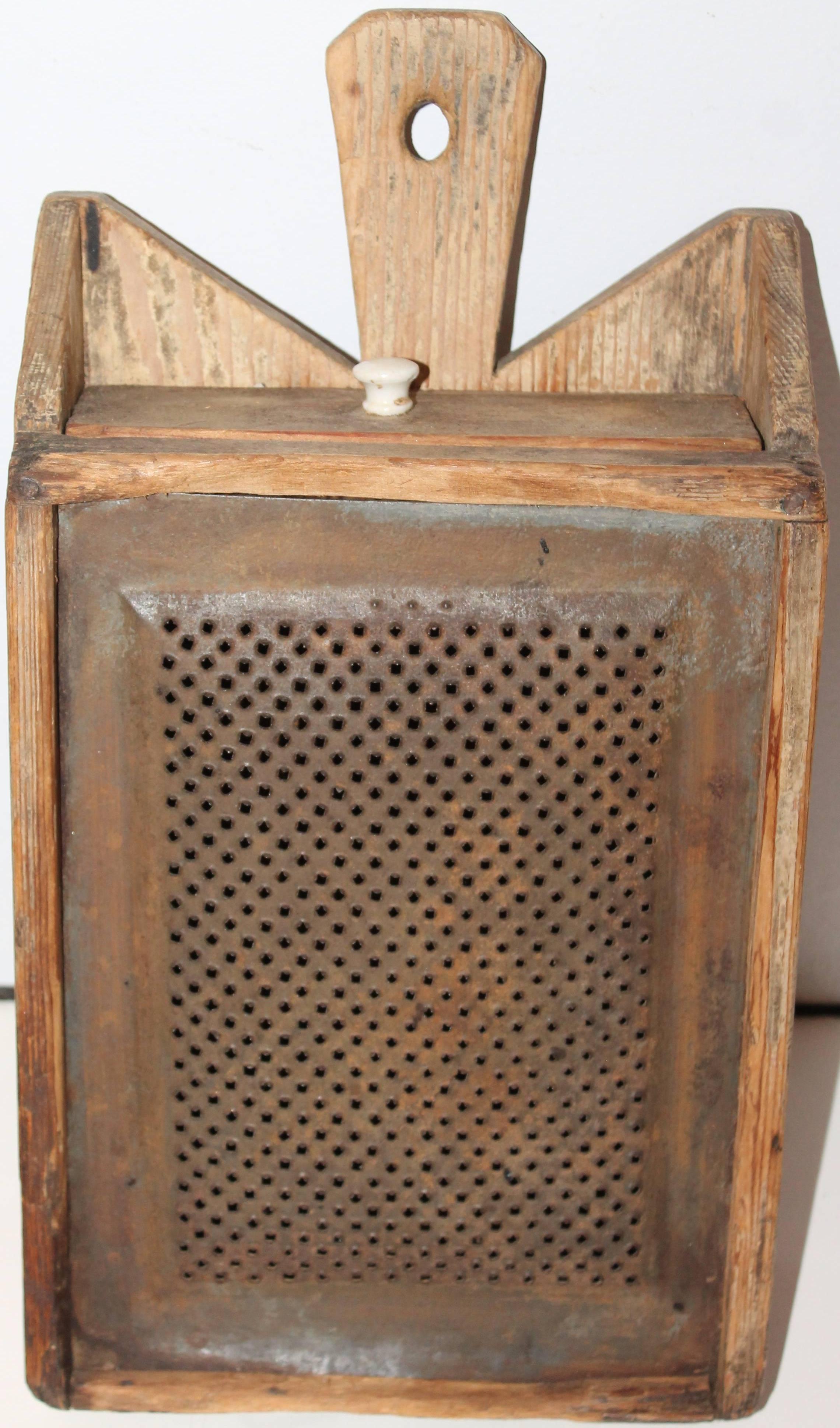 This early all original cream painted grater wall box. This early painted table top or wall-mounted kitchen work box is in great as found condition. The box is all square nail construction and has a amazing undisturbed surface. The base looks like a
