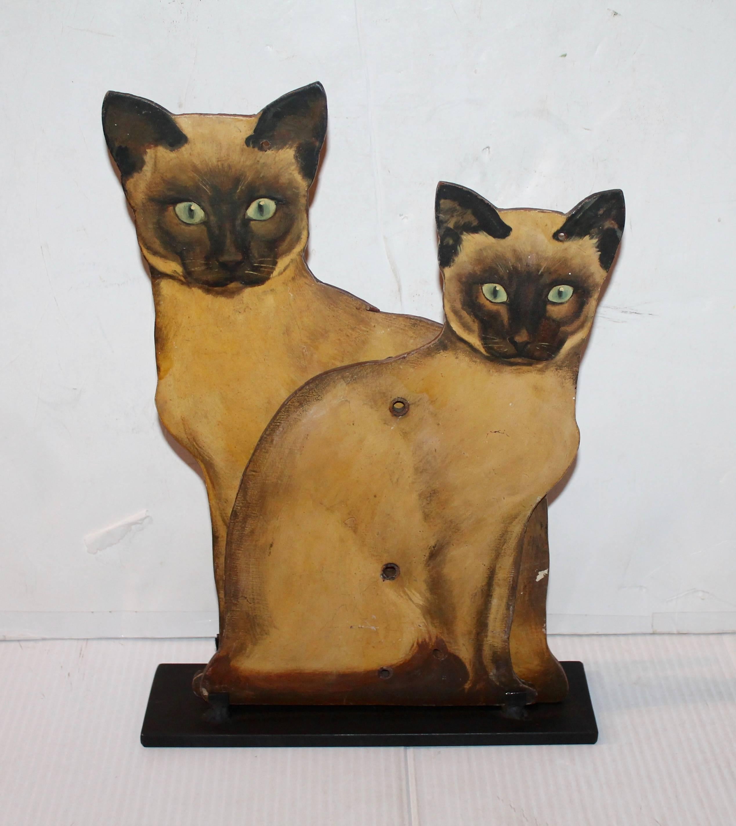 These folk handmade and painted cats are on wood and can intersect together. One cat is larger then the other and both are different. Could be mounted on cast iron mounts for show. Large cat is 15