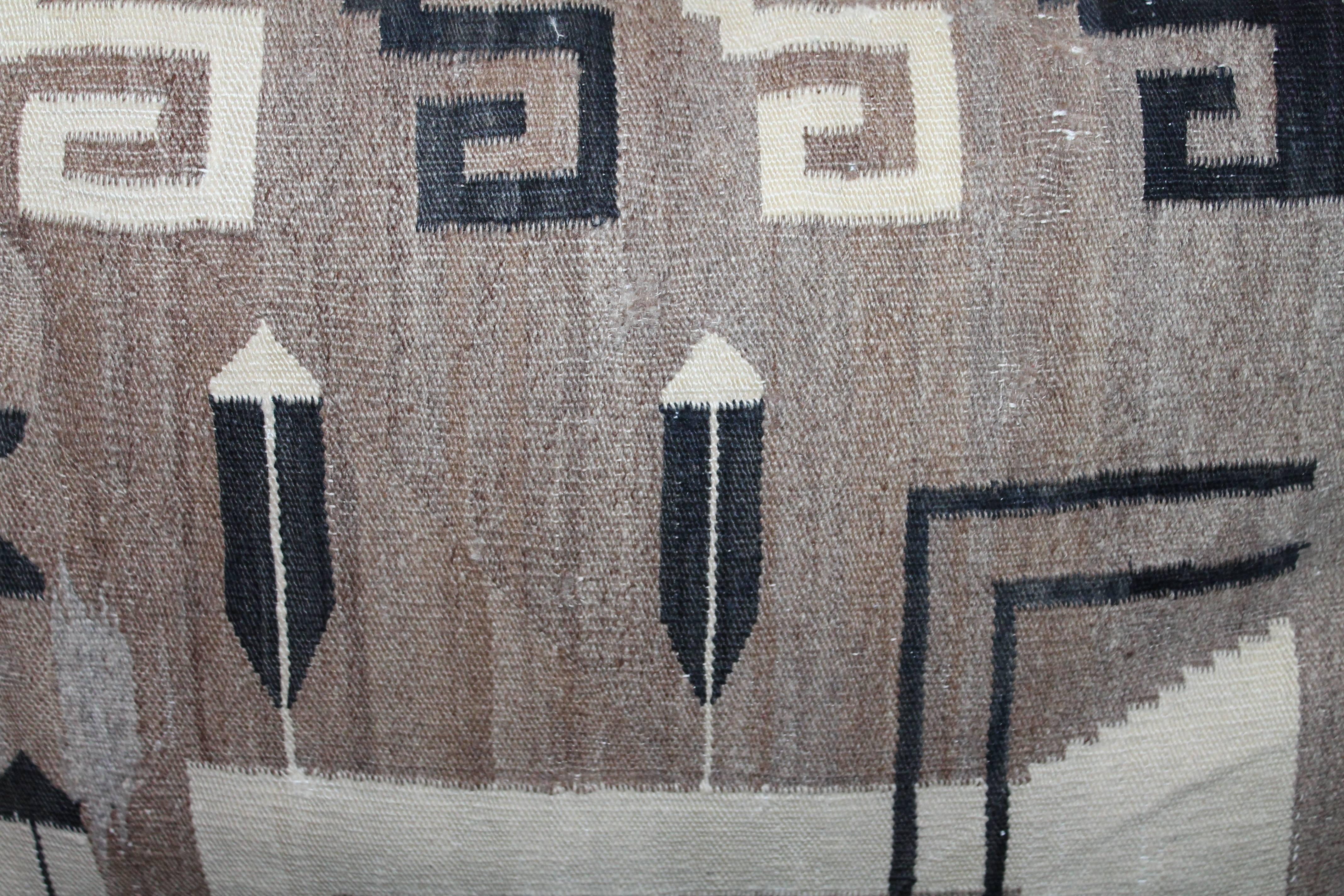 This is one of four fantastic and large Navajo Indian weaving saddle blanket pillows. The muted and soft colors are the very best. Condition is good.