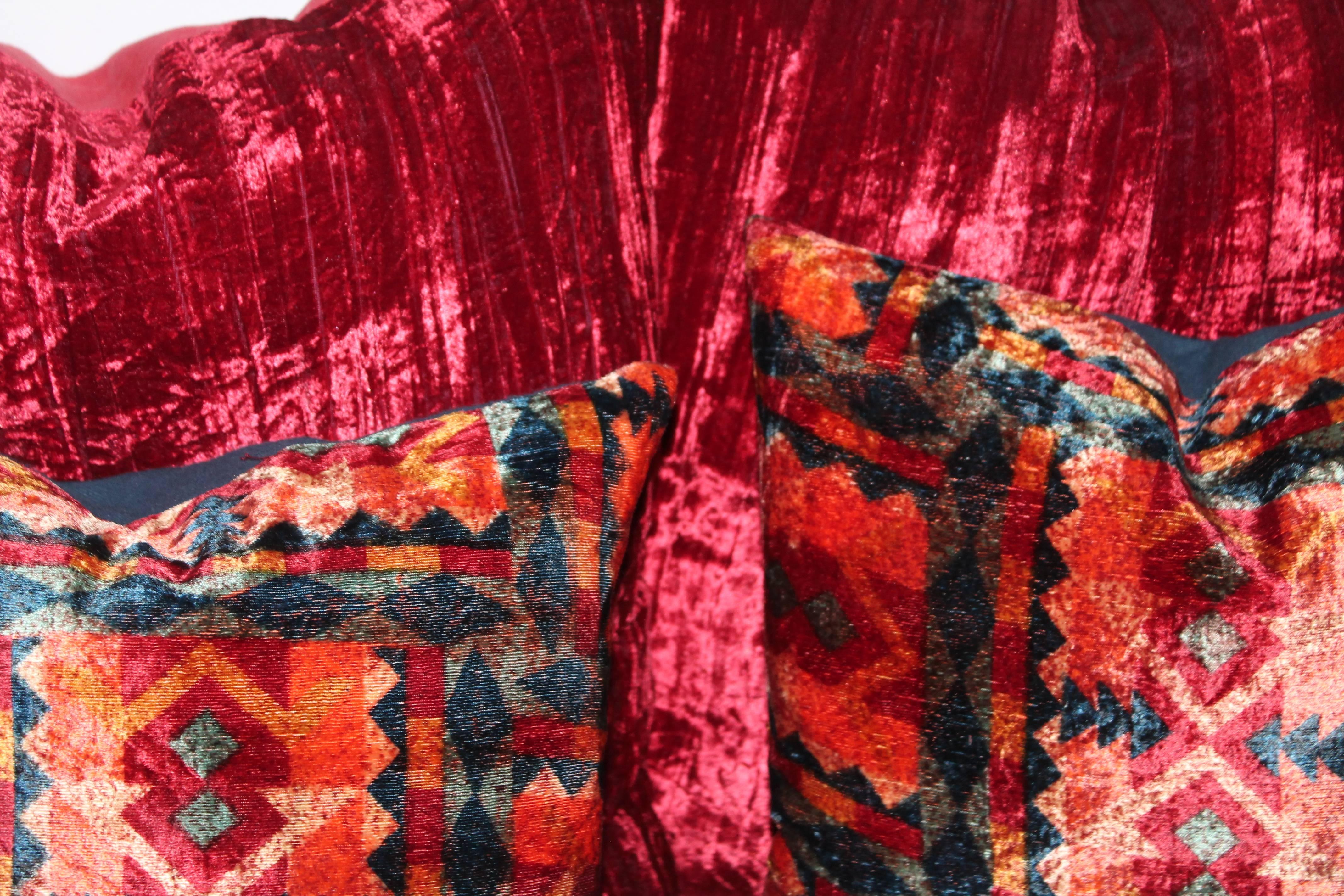 These vintage red silk velvet pillows have red cotton linen backings. There are two pairs in stock. The smaller patterned silk velvet pillows have blue cotton linen backings. The red velvet are 21 x 21 and the multi patterned velvet are 18 x 18 in
