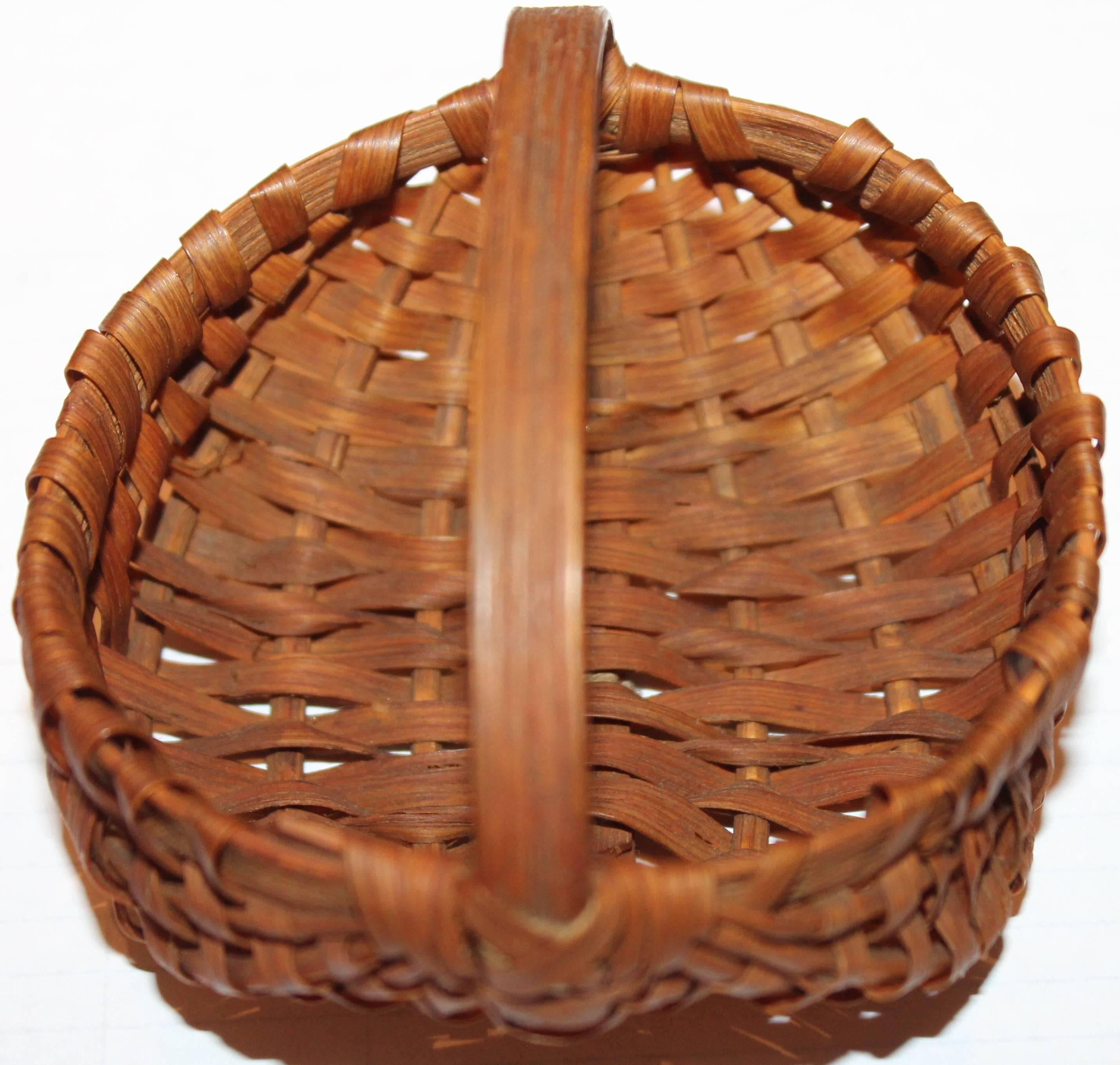 This early handmade basket is a miniature 19th century hiney basket from New England in great condition. This is a collector's dream.