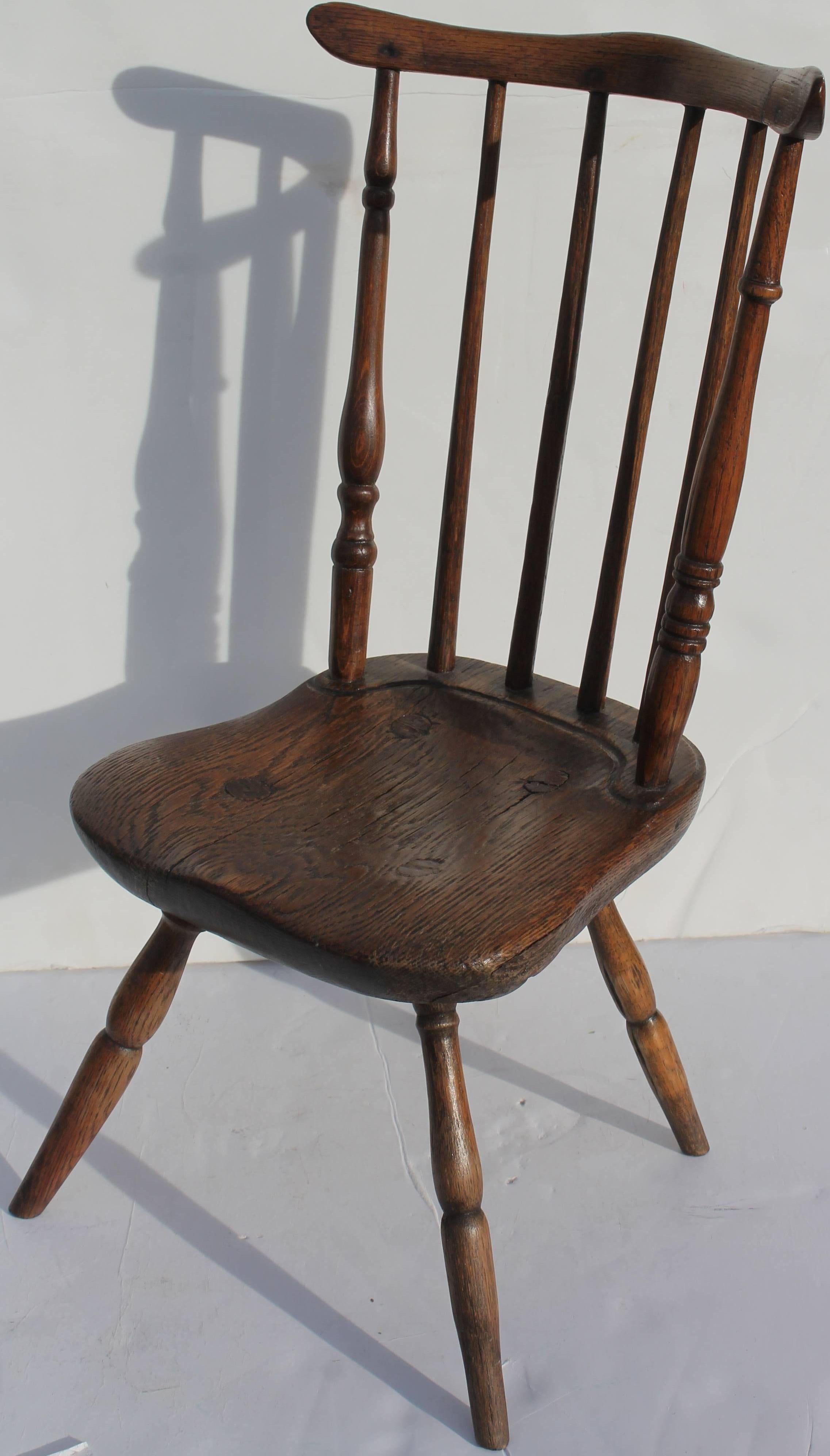 The form of this amazing little wonder is just fantastic. The condition is very good with a wonderful aged patina. The construction is early wood pegs and small square nails. The legs are mortised through to the seat. This is a rare find.