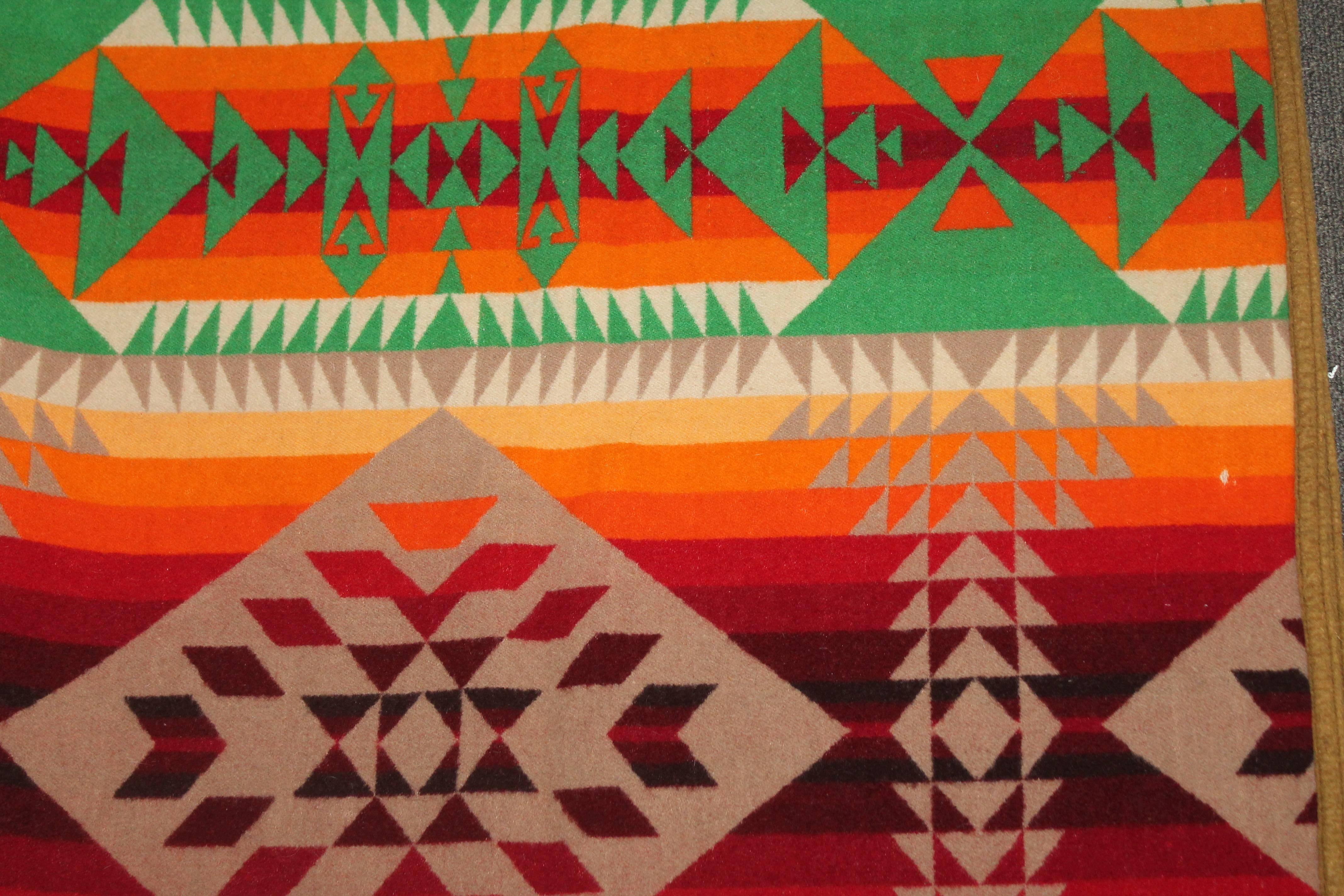 This wonderful graphic and all original Pendleton camp blanket is in great as found condition. The original worn label is in the lower right hand corner. This is blanket is different pattern on each side. It is dated 1909 in the label.