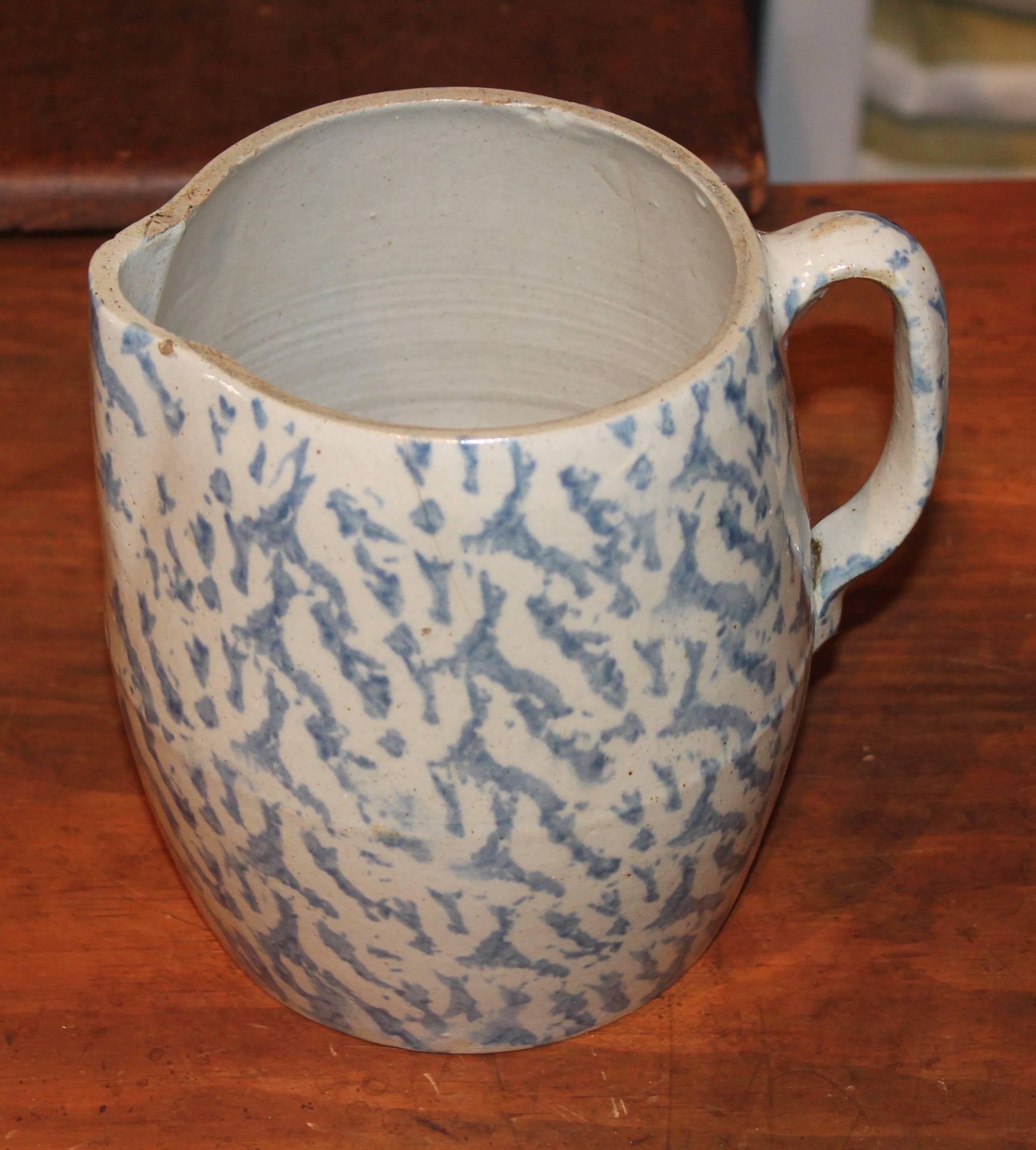 19th century large spongeware milk or cream pitcher used on the farm. This pitcher is a little different then most due to the girth of it. The condition is good with small minor chips on base, unseen.