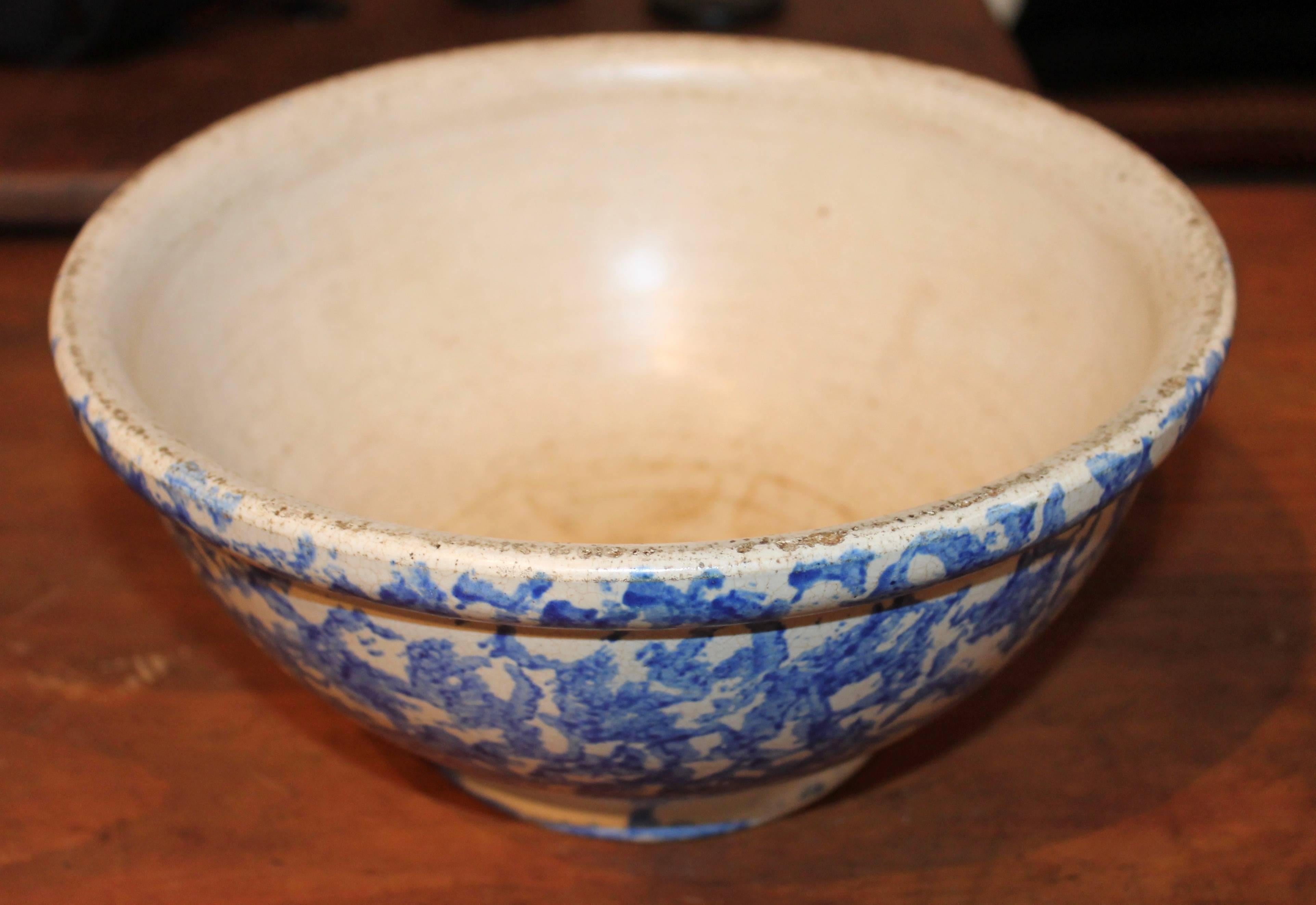 This amazing crazed 19th century spongeware mixing bowl is signed on the base Elsinore Pottery, California. It is most unusual to find any type of sponge ware pottery signed. The condition is good with minor crazing.