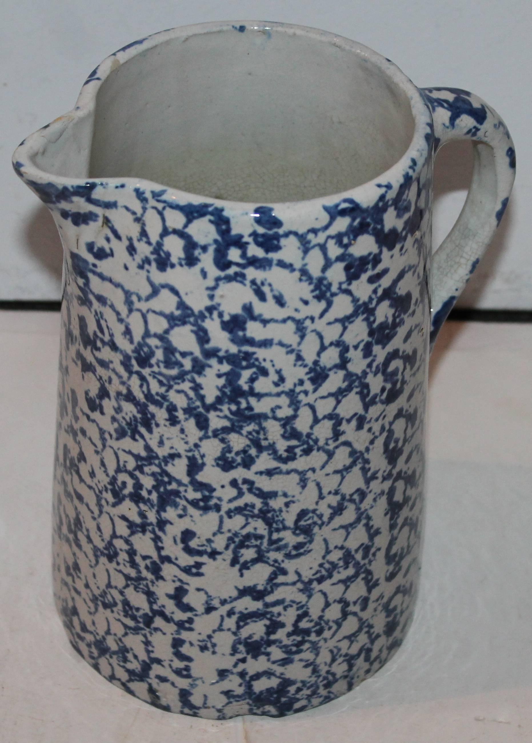 This is a wonderful dark blue spongeware pitcher. The condition is good with minor crazing from age.