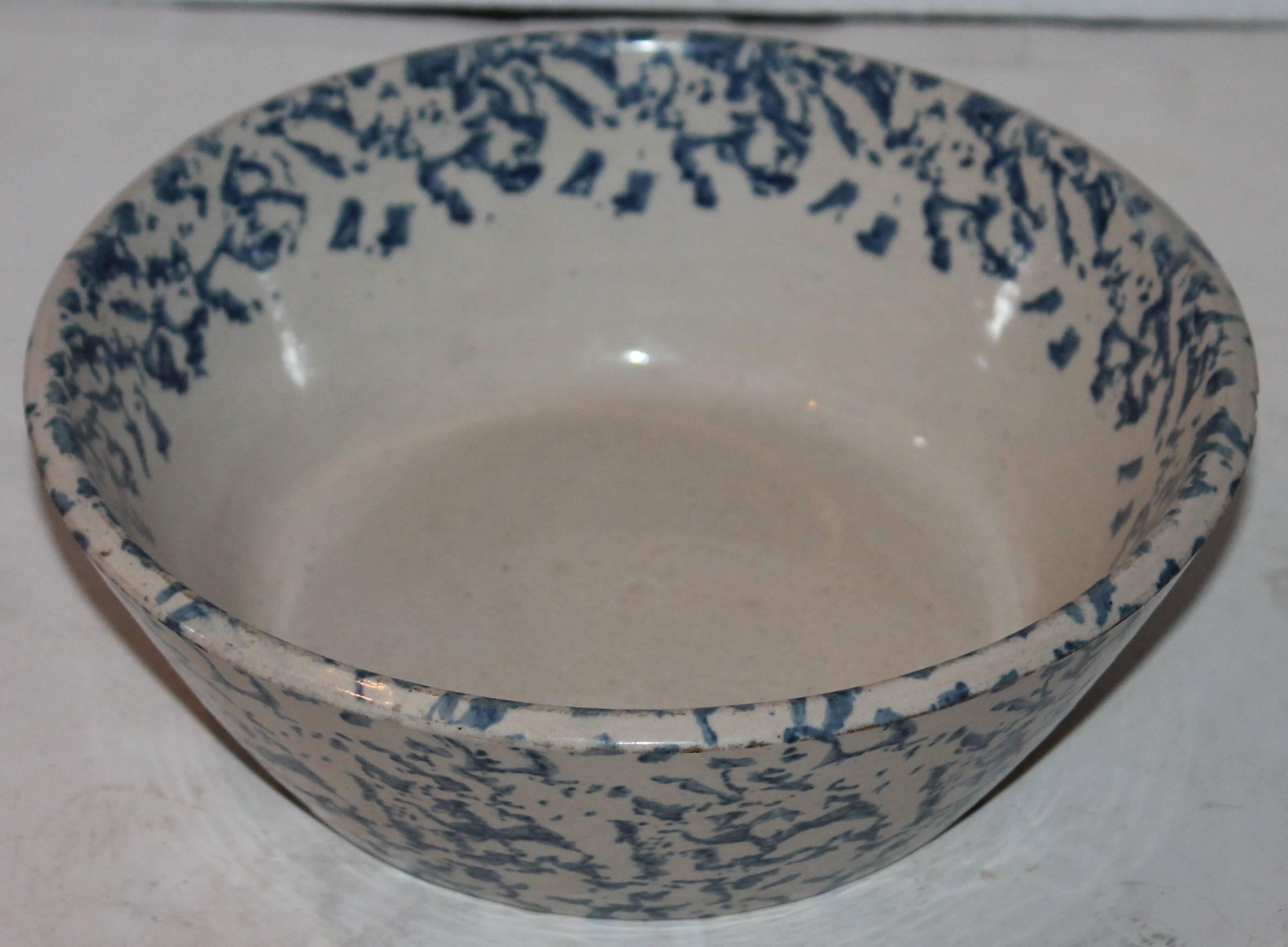 19th century spongeware cream bowl in good condition. This is an unusual form. The color is a lighter indigo blue.