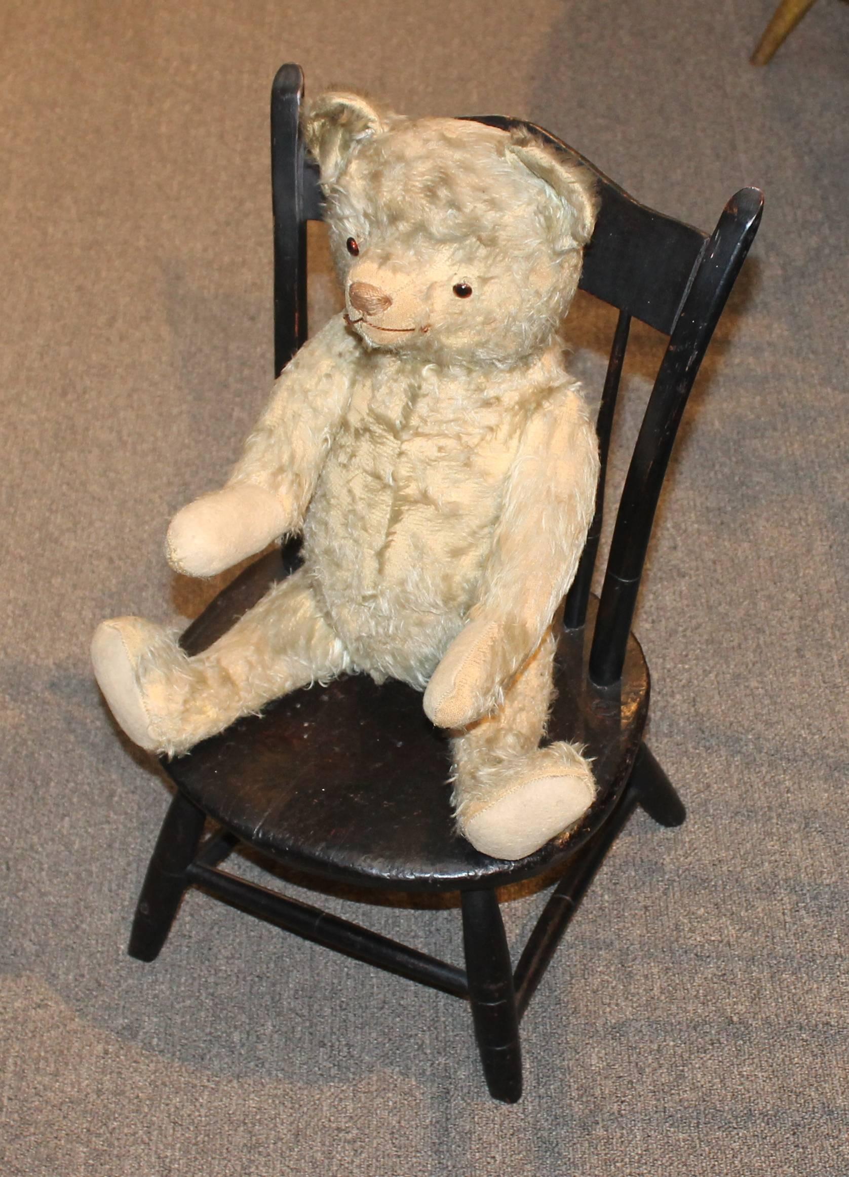 This fun and worn bear is in good condition and has been well loved. It is all jointed and glass eyes. It looks like a Steiff but has no button. The mohair coat and body is in good condition.