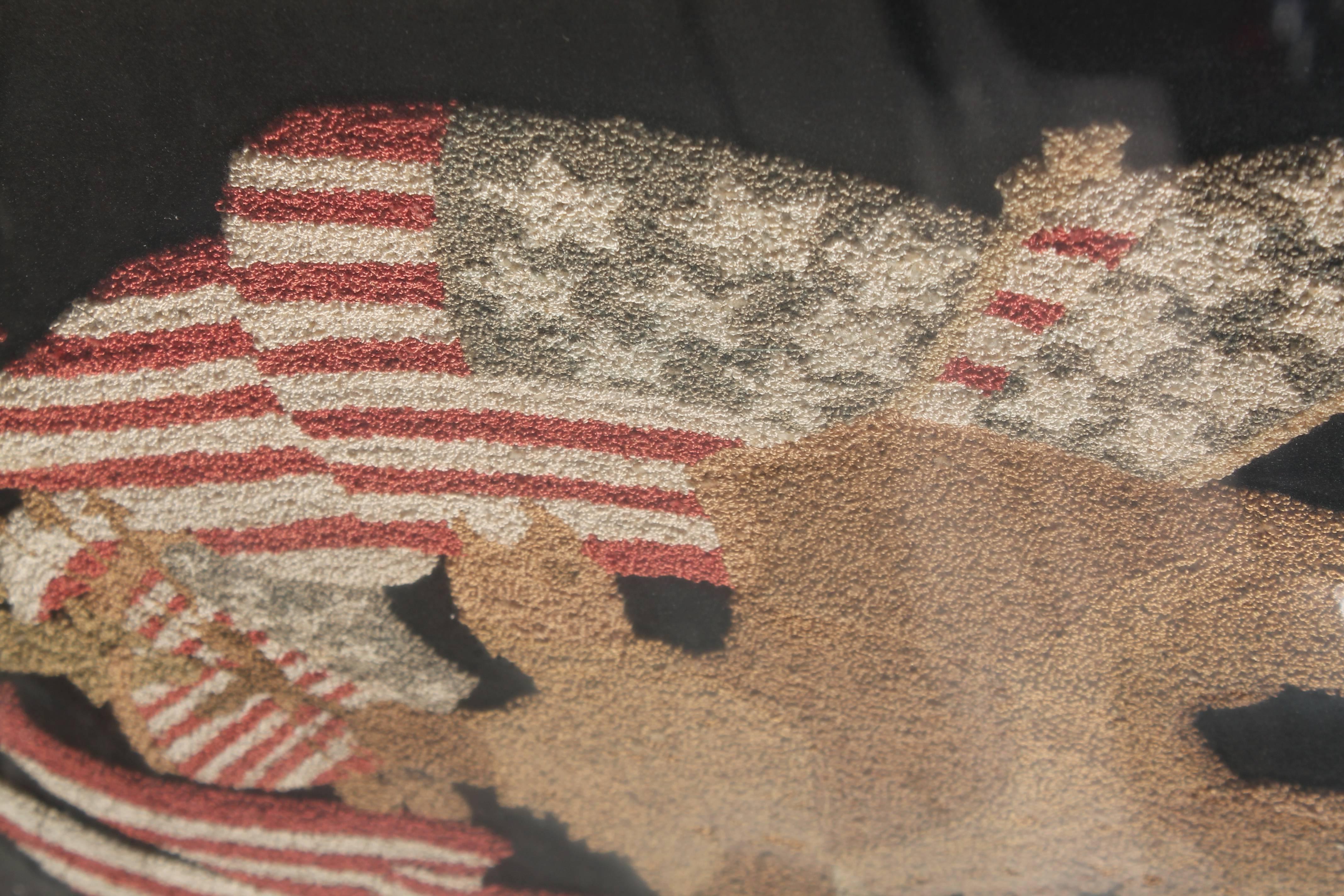 Needlework Mid-19th century embroidered eagle with original frame.
