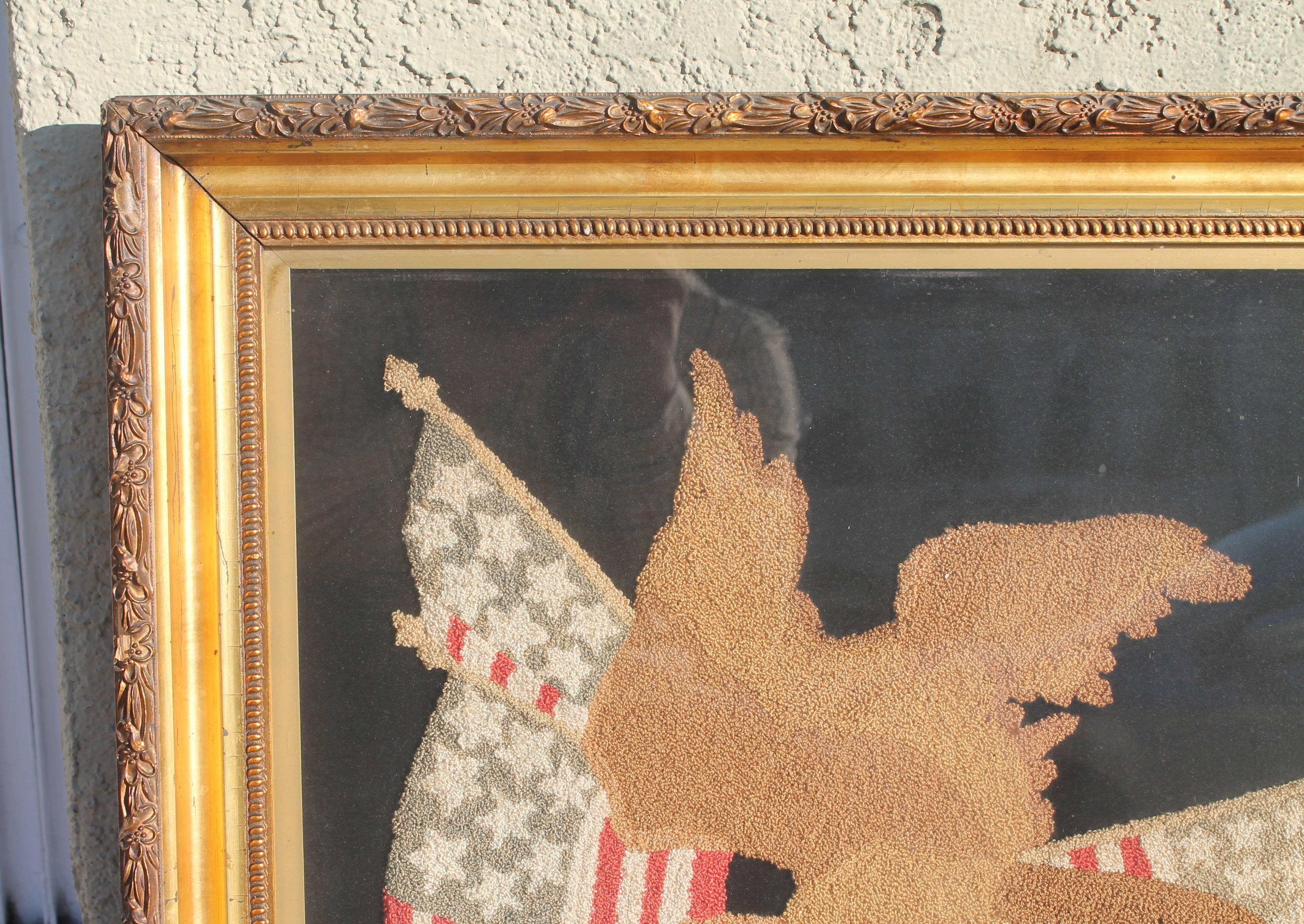 Folk Art Mid-19th century embroidered eagle with original frame.