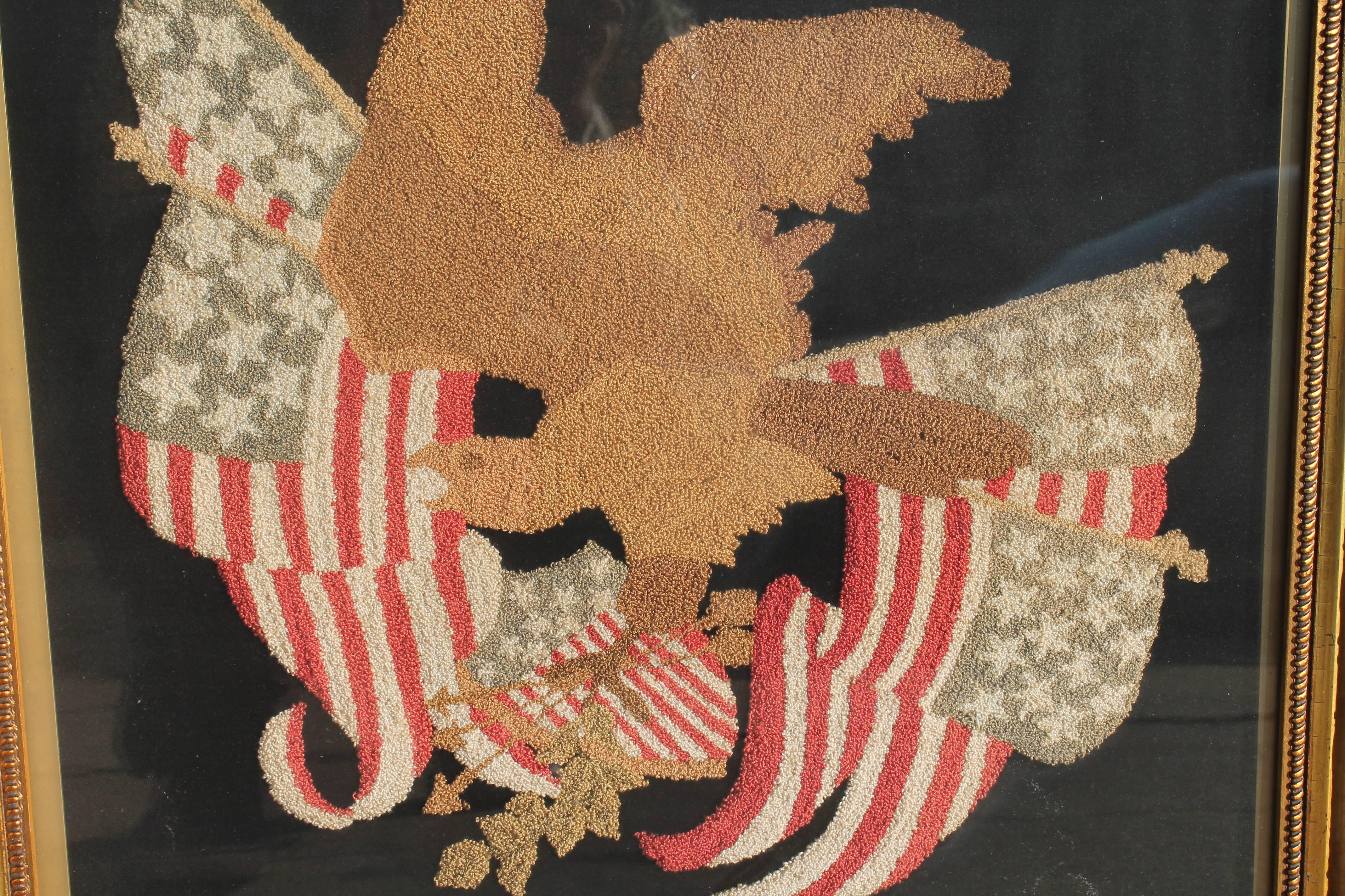 American Mid-19th century embroidered eagle with original frame.