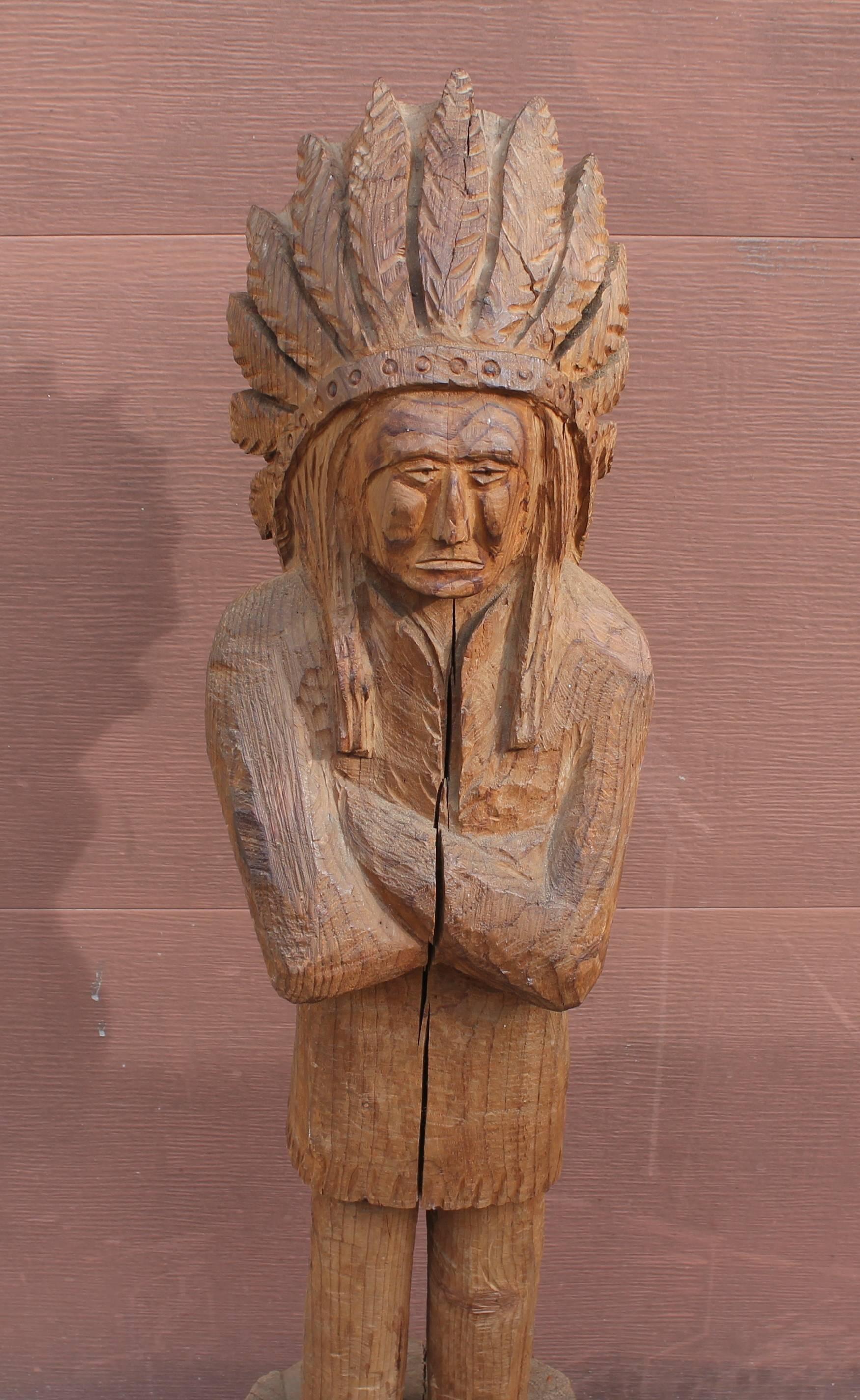 This amazing all hand carved and all  original undisturbed surface cigar store Indian was found in the mid west. The condition is very good with shrinking cracks through out the entire piece. So many of these guys have been painted however this was