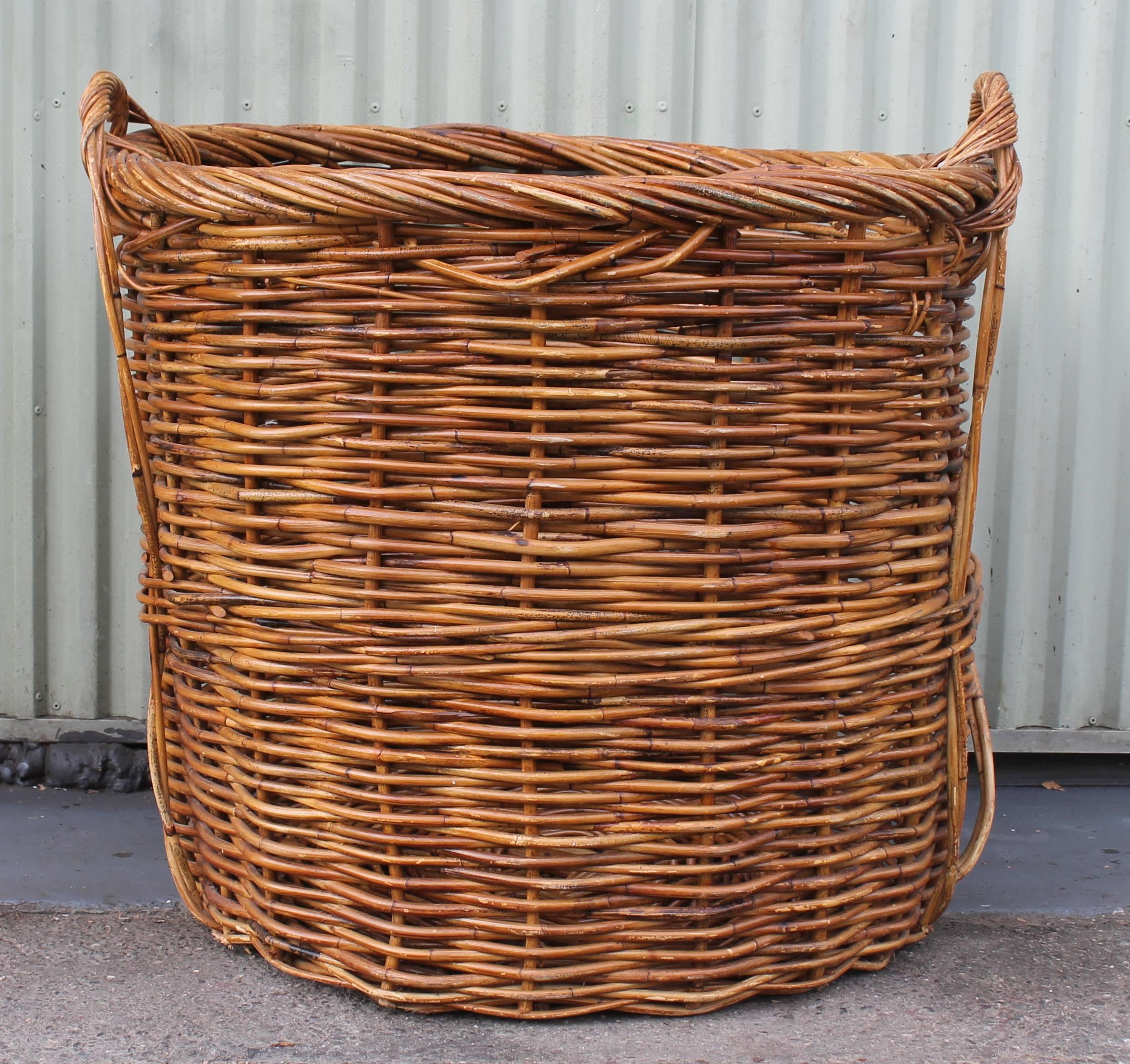 This amazing huge double handled 19th century field or cotton gathering basket is one of the largest we have ever seen or owned. The condition is very good with minor breaks in some areas but does not detract from the beauty or condition. Great to