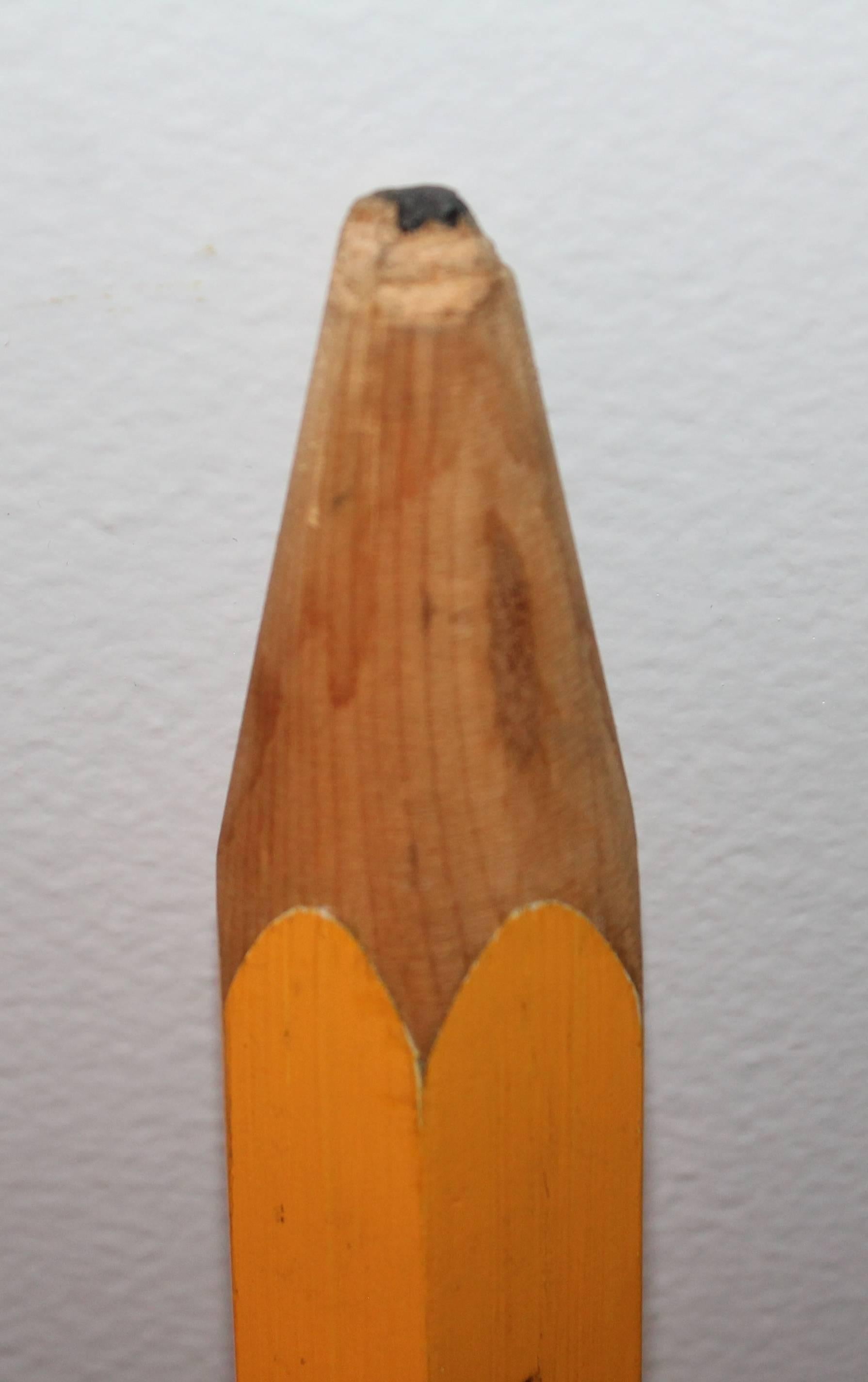 This large folk art pencil has imprinted Western Michigan University probably for advertising the college. The condition is good.