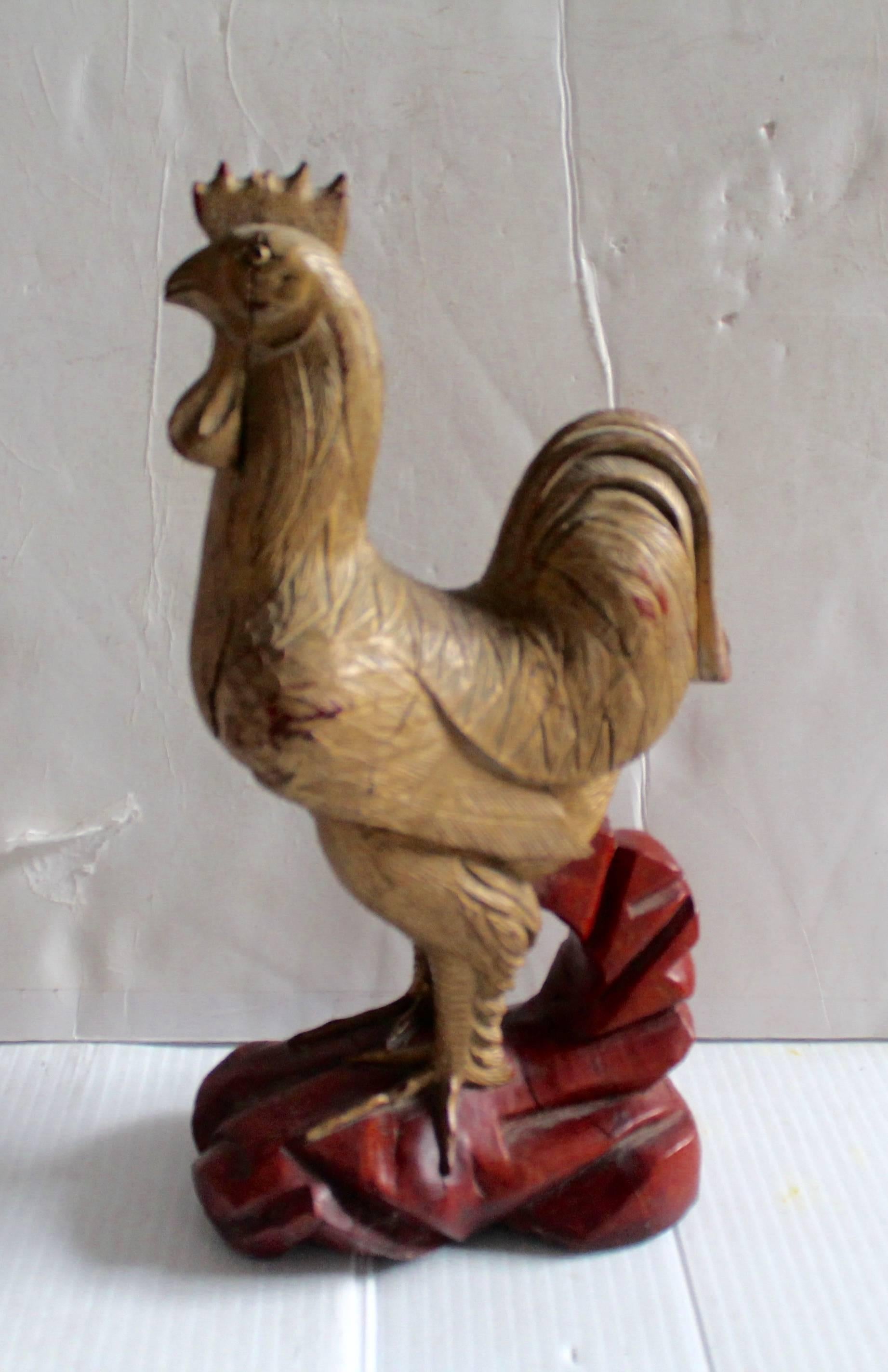 This hand-carved and original painted wood rooster has glass eyes and minor cracks in wood. The condition is good with a wonderful undisturbed surface. Great patina.