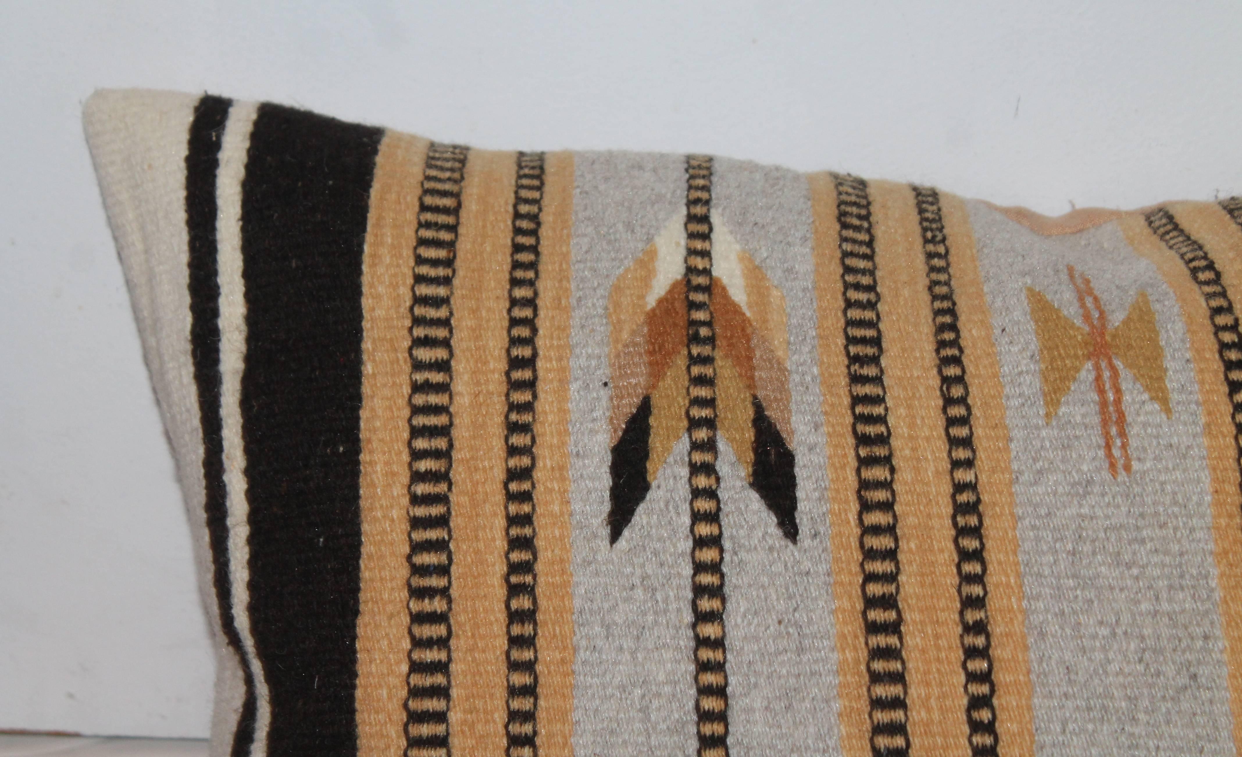 Geometric Navajo Indian weaving bolster pillow with a cotton tan linen backing. The condition is very good.