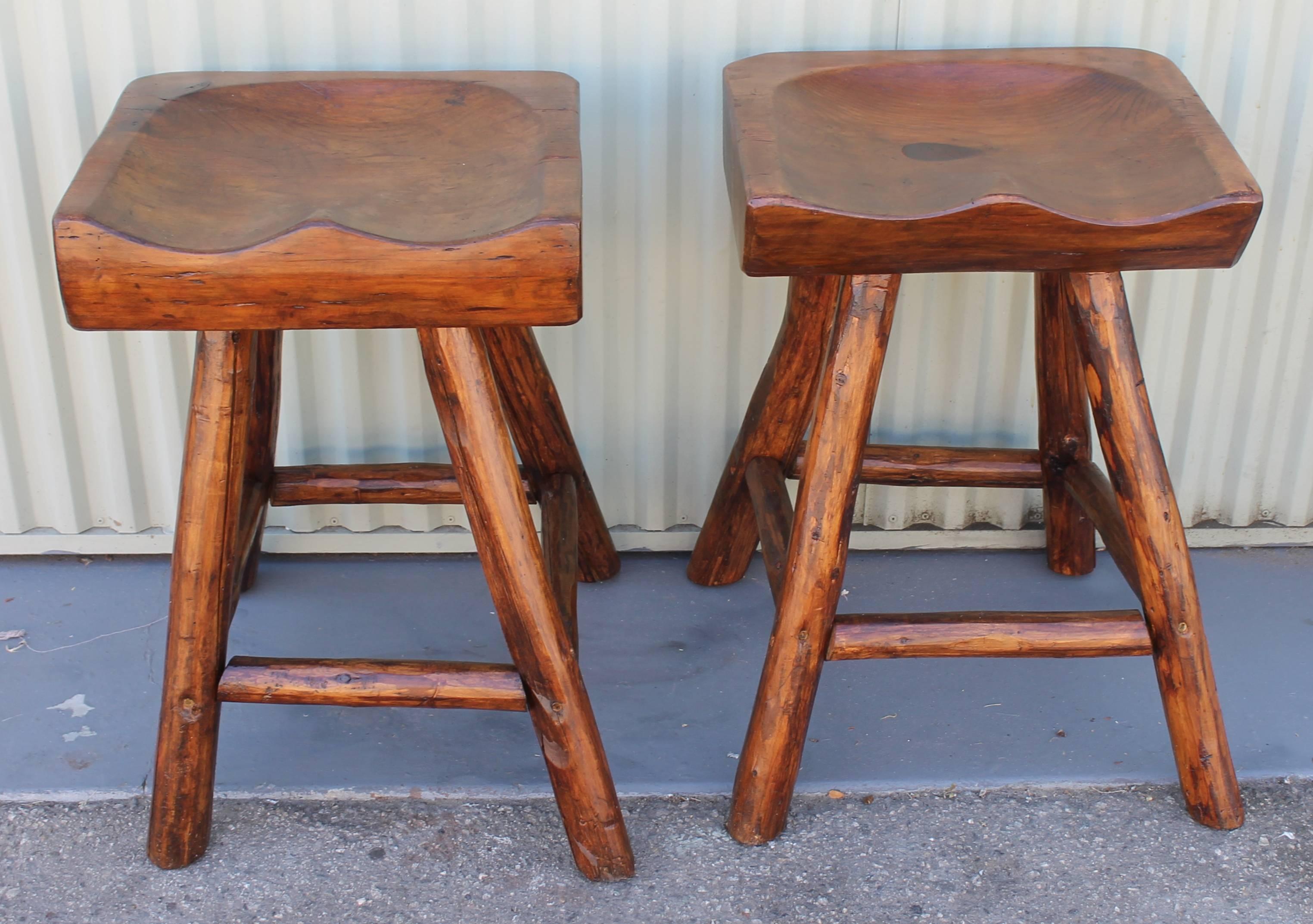 This rustic pair of stools are in amazing condition. The base is made from hickory and the stool has a rustic modern feel. Very clean lines. Condition is very good. Made in Sheboygan, Michigan by Rittenhouse Furniture Company.