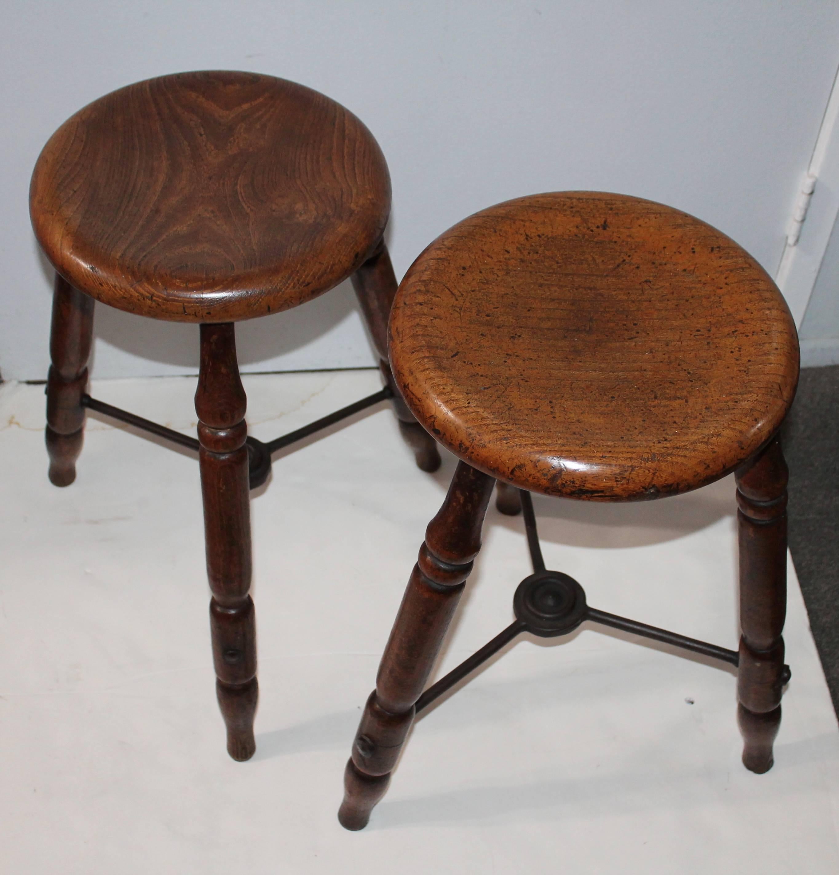 This pair of stools are in fine condition. They were probably used in a sewing or leather shoe factory in the 19th century. They are a matched pair and will be sold as such.