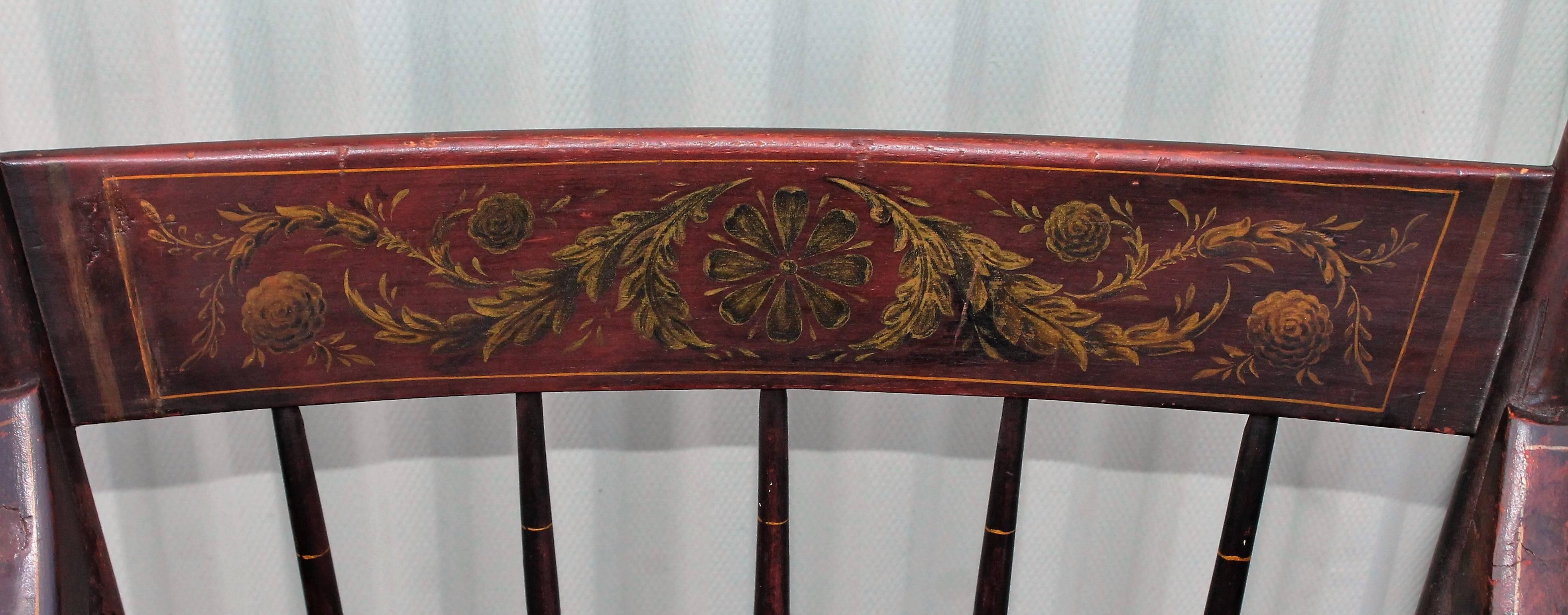 Early 19th century original painted Hitchcock armchair with a decorated inside back. The condition is very good and sturdy. The back round has a wonderful redish brown surface. The paint is in a undisturbed patina.