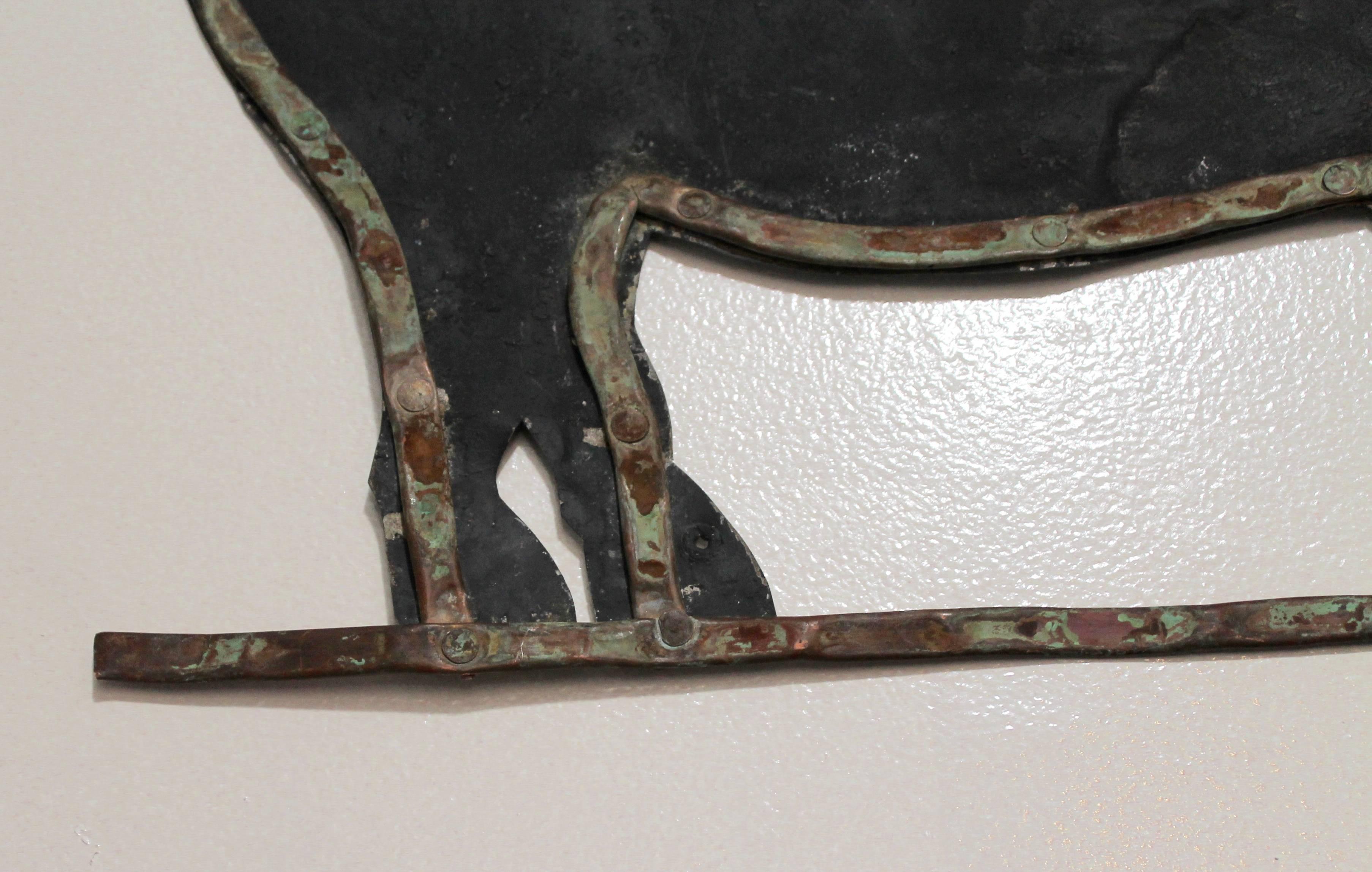 This pig sign was probably used for a pig or hog farm in the Midwest. The sign is comprised of galvanized tin and trimmed in copper piping that was flattened with a copper stem. It almost looks like it was a make do sign made from a weather vane.