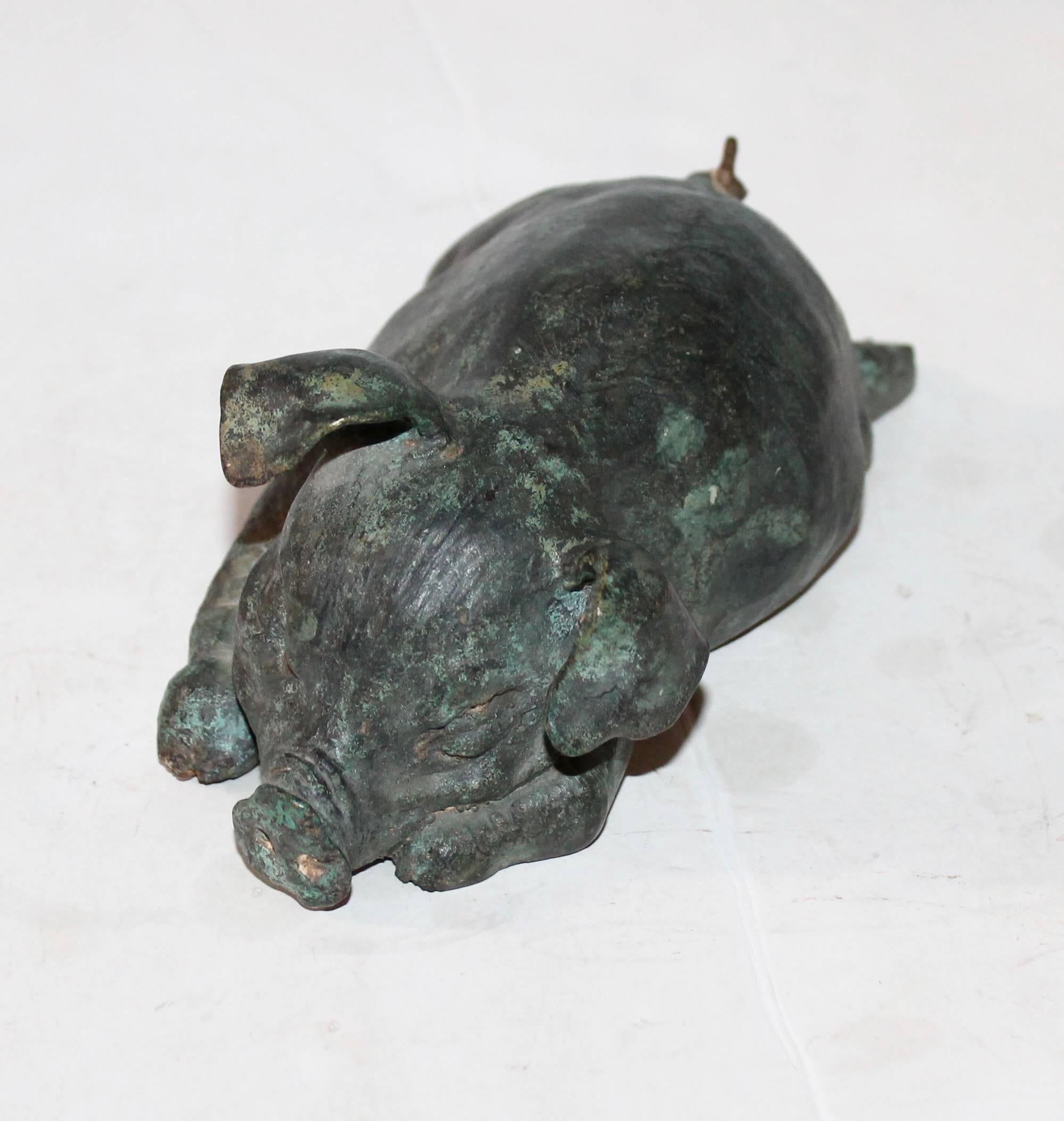 This fun pig is a handmade, heavy sculpture that has no makers marks or signature. She has a wonderful aged patina. Wear consistent with age and use. Great on a desk or shelf.