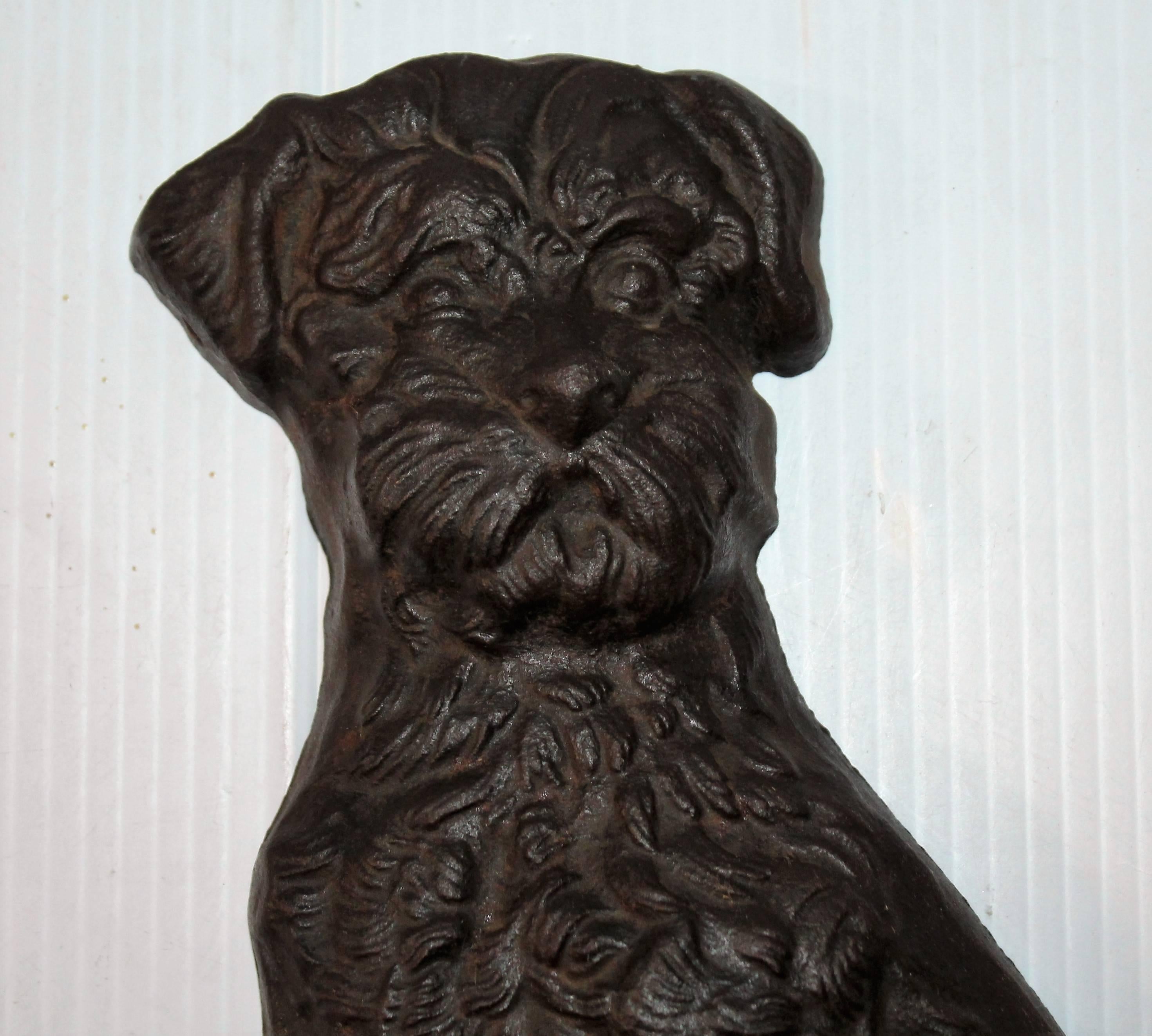 This large folky dog doorstop has a great look for a profile of his body. This iron dog has a makers mark of LB 71. Looks like Snoucher.