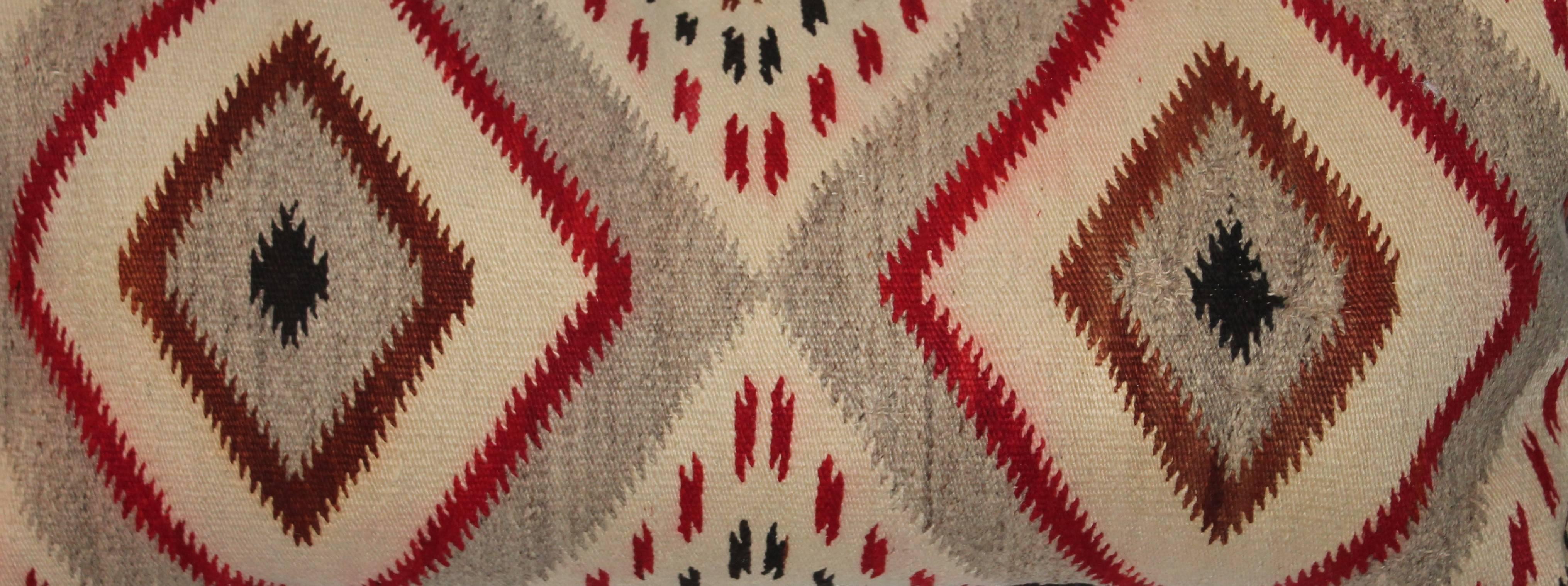 Navajo Indian weaving bolster pillow with a wonderful saw tooth pattern. The backing is in a black cotton linen.