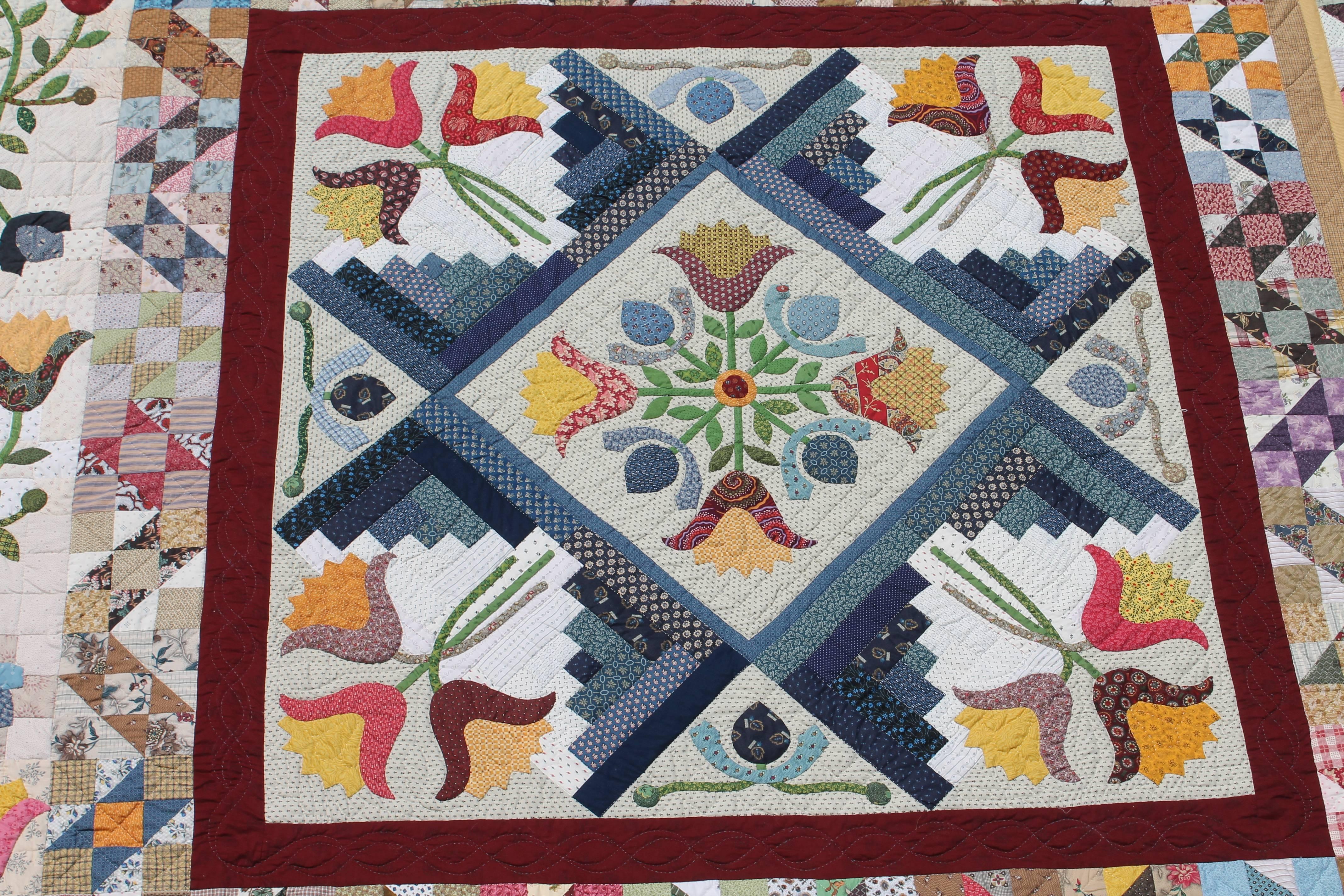This later version of a very early 19th century applique and patchwork quilt is in wonderful condition and would fit a queen or king bed. This quilter was the very best at piecing and her artful quilting talent. It is signed on the reverse by the