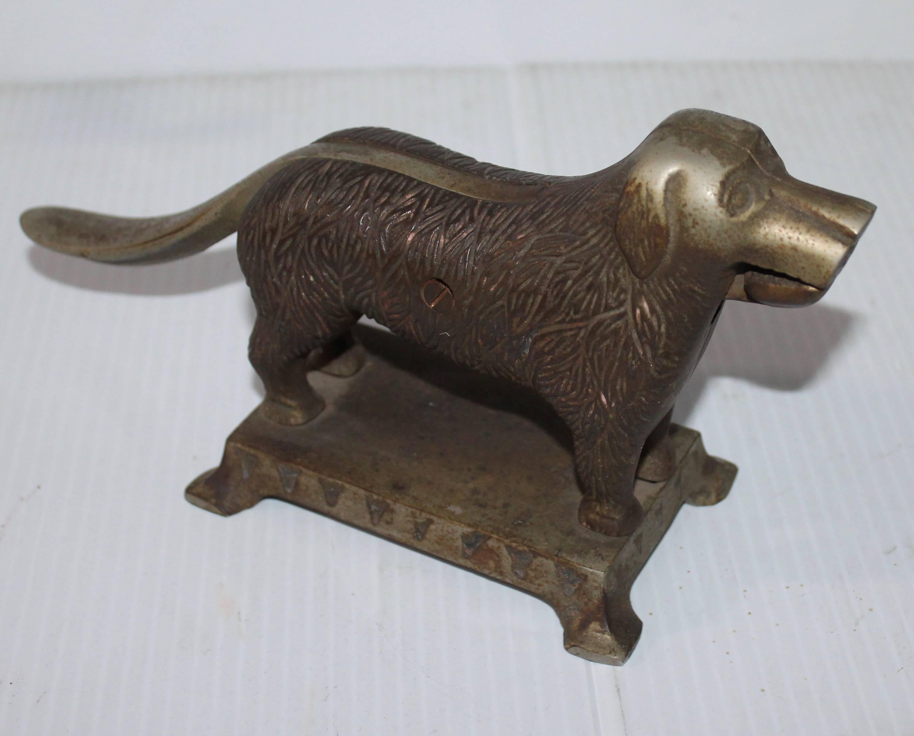 This signed cast iron dog nut cracker is made by L.A. Althoff Mfg. Co. makers of Headlight stoves and ranges, Laporte, Indiana and all this is embossed on the base of the nut cracker. Amazing undisturbed surface. The best patina.