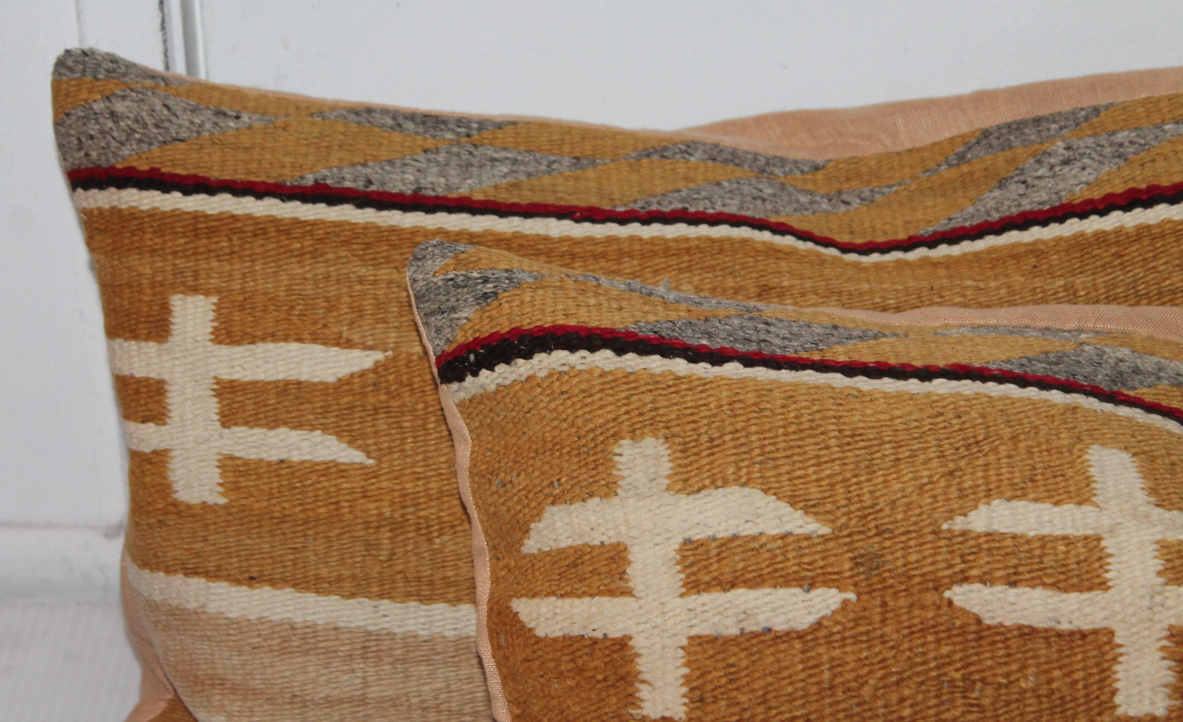 These are amazing pair of American Indian weaving pillows with most unusual colors and pattern. This pair of pillows have tan backing.