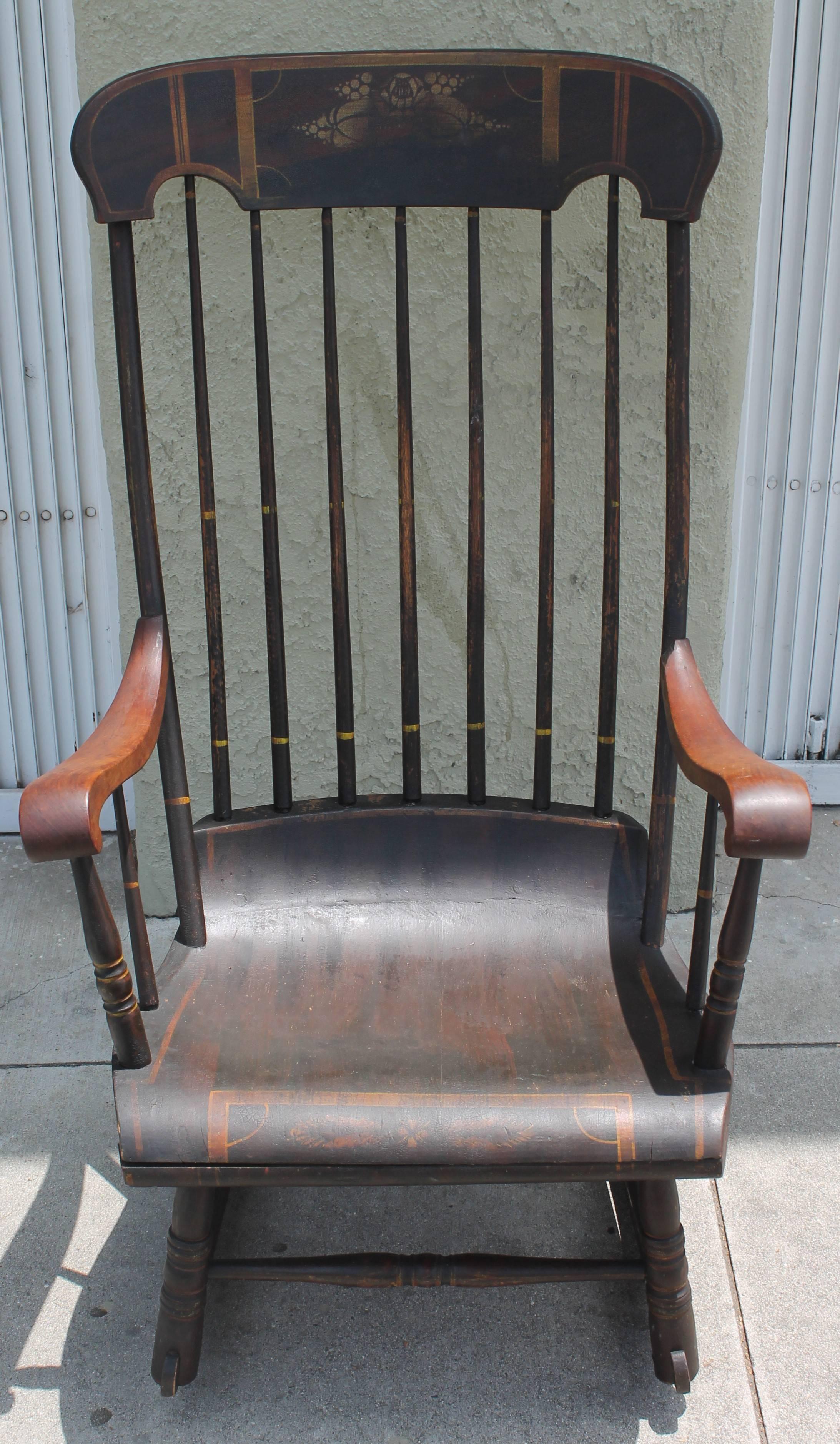 This original painted rocking chair was found in Boston, Mass and has all the original decoration and pin striping paint. The condition is very good and sturdy. Minor wear in paint consistent with age and use.