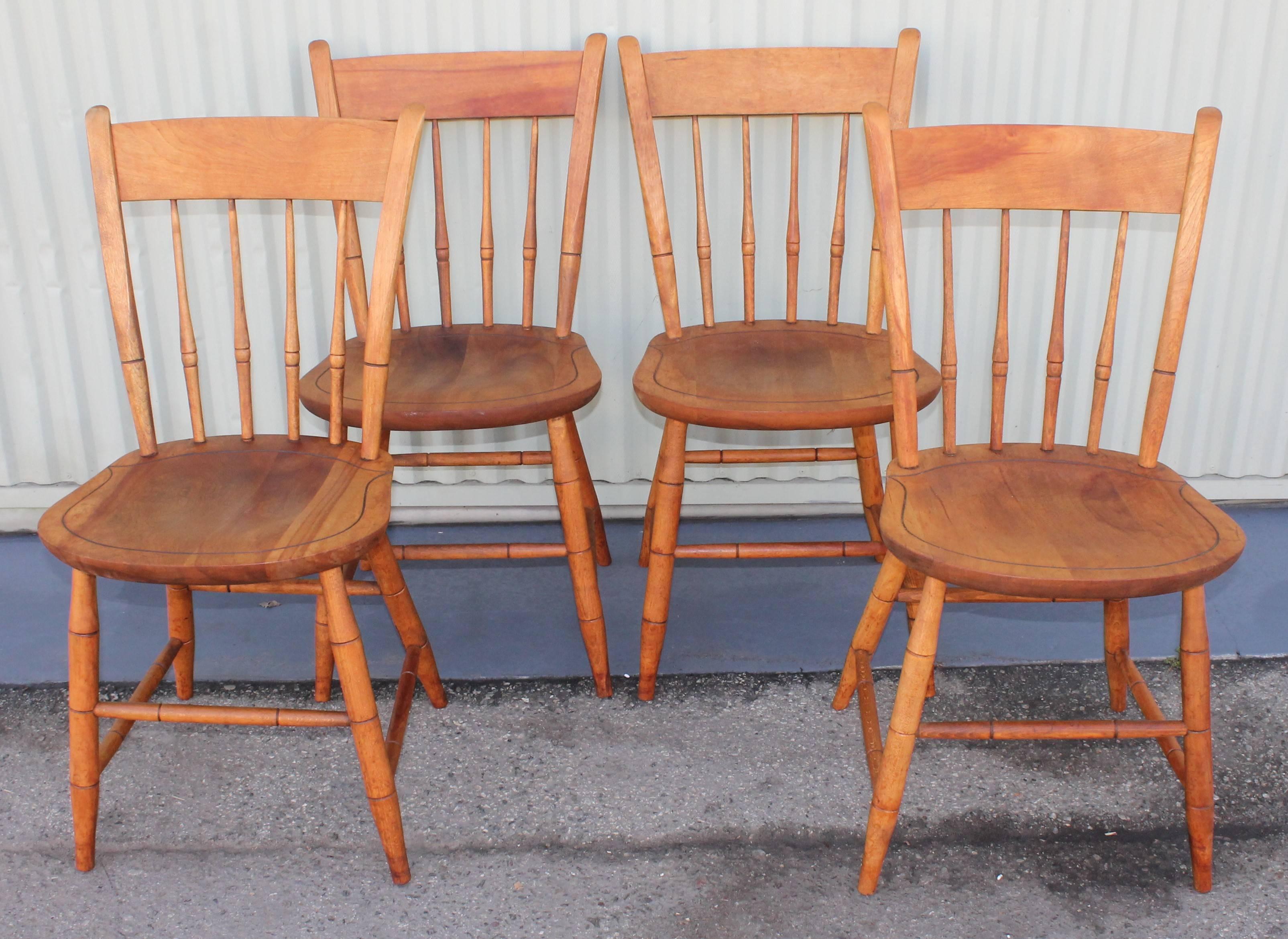 This smooth set of s maple thumb back Windsor chairs are signed on seats Nichols & Stone Co. , Gardner, Mass. They are in a natural original surface and very sturdy.