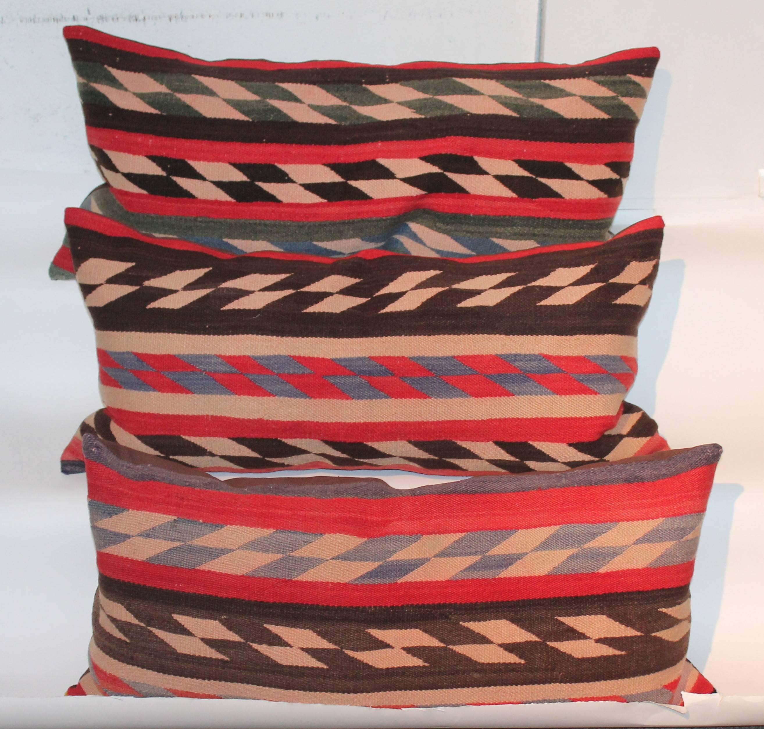 This fine group of Navajo weaving pillows are from an early Navajo saddle blanket. The condition are good with minor fading through out. The colors are amazing. Sold as a group for 1895 or 895. each.