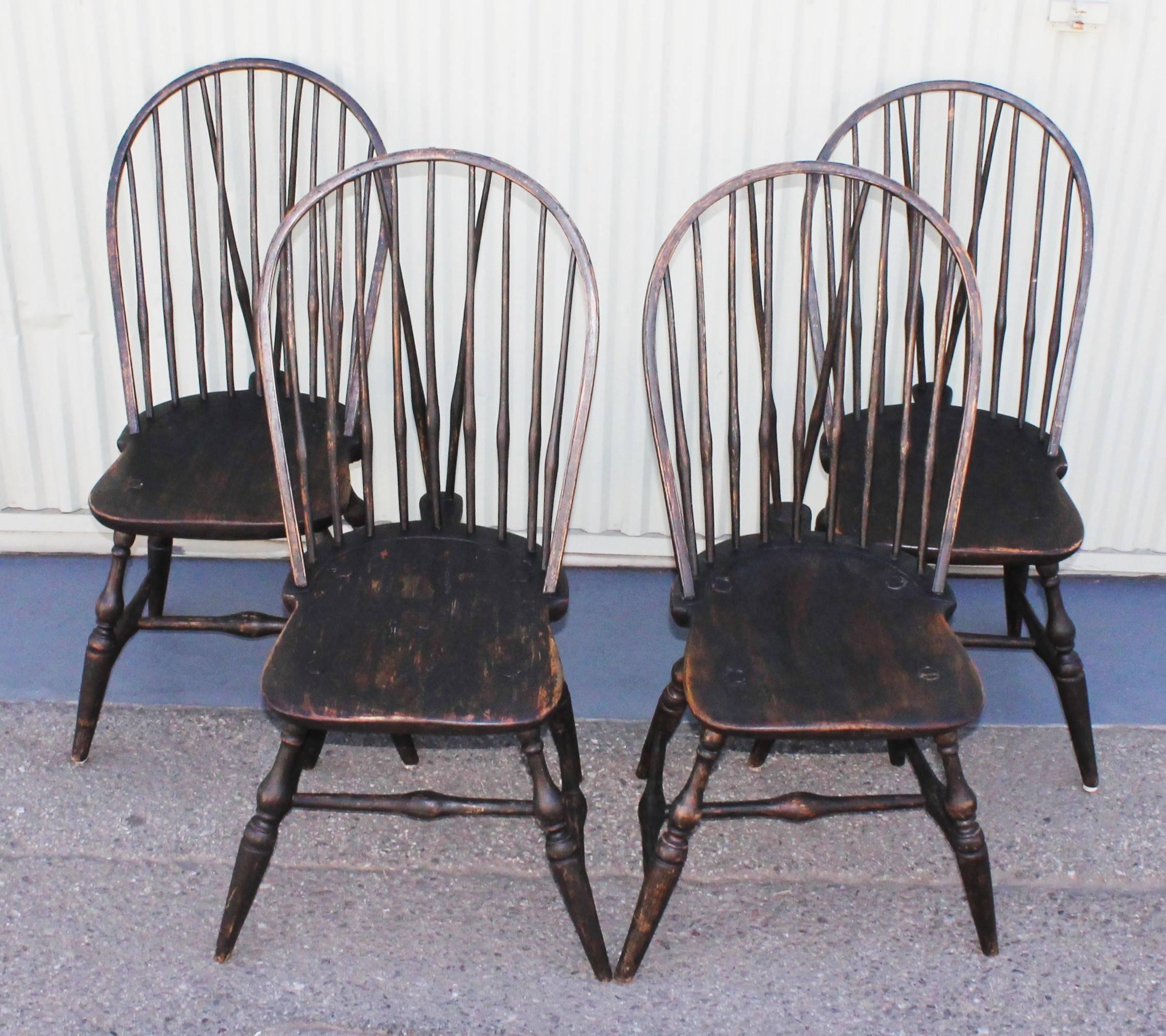 This fantastic set of four matching 18th century Windsor chairs are in great condition and very strong and sturdy. The painted surface is second generation or over painted with wear consistent from age and use. The chairs are very comfortable.