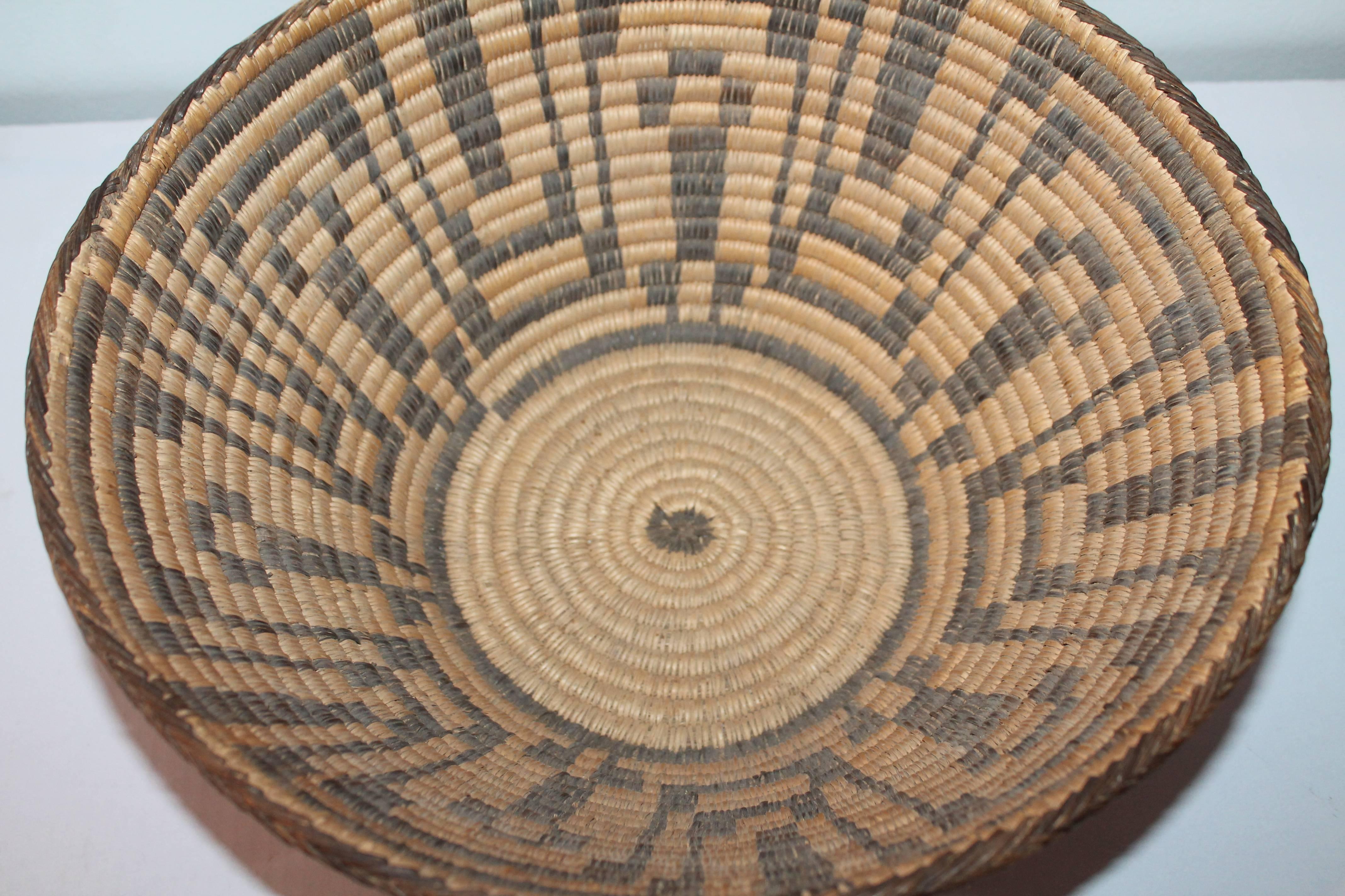 This large 19th century geometric Pima Indian basket is in fine condition and is quite large in size. A great addition to any Indian basket or American Indian collection. The man in the maze pattern.