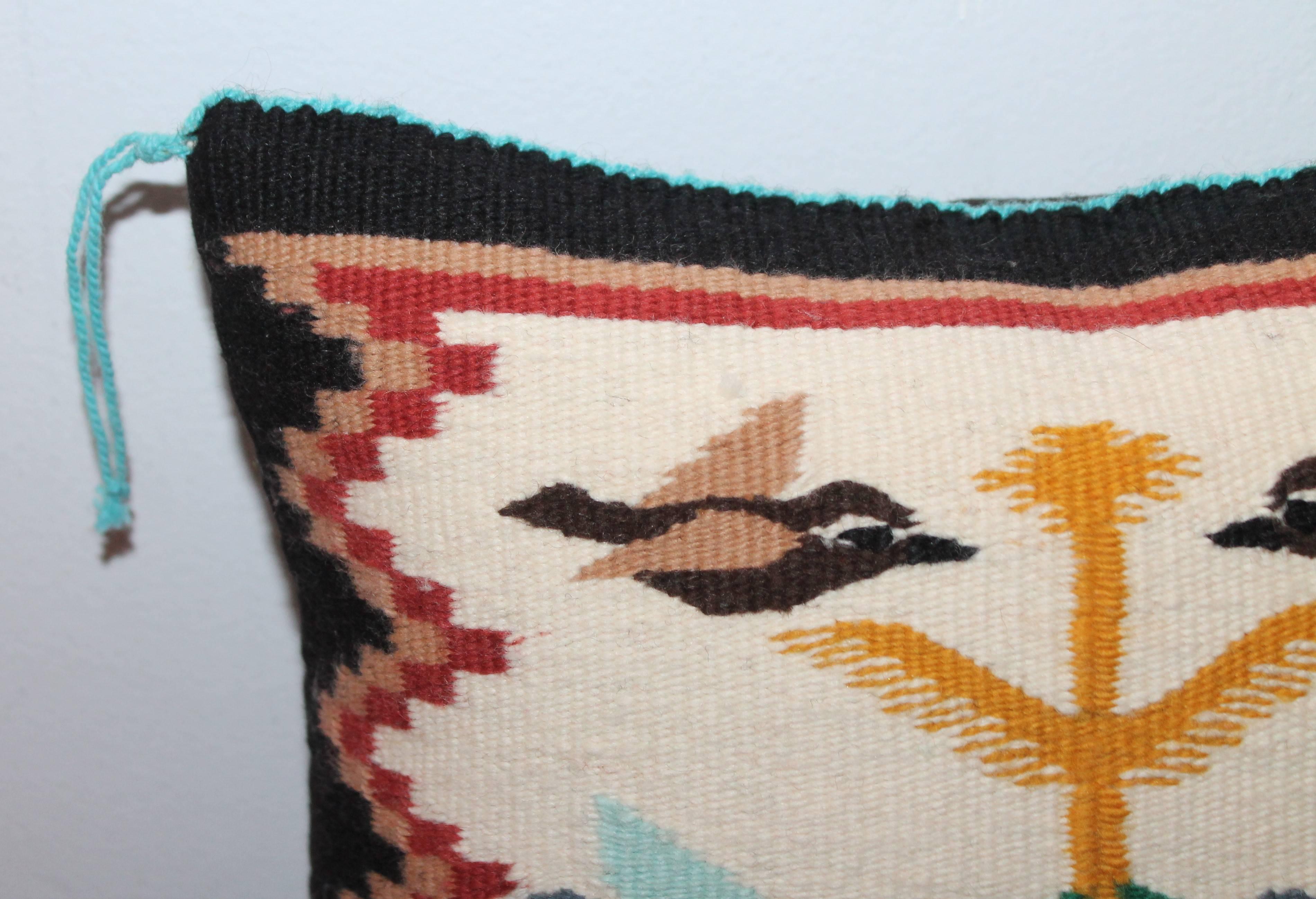 This fun pillow has different color birds and has a black cotton linen backing.