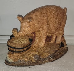 Topes para puertas con forma de cerdito de hierro fundido del siglo XX