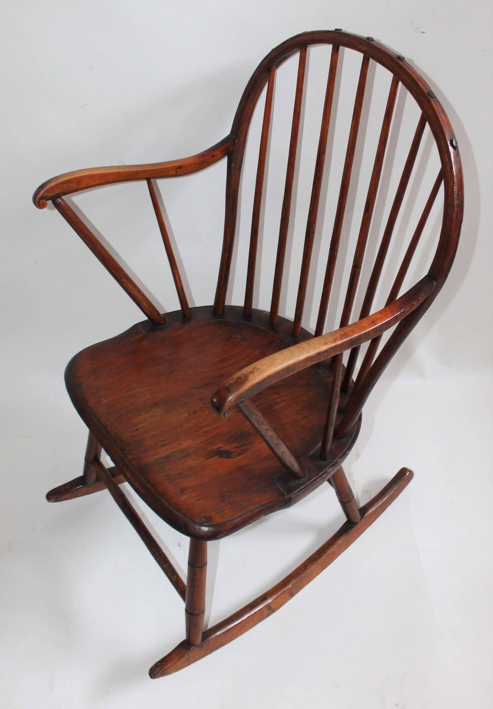 This amazing undisturbed surface rocking chair comes from a private collection and is in pristine as found condition. This stick Windsor rocking chair has bamboo turned legs and great surface.