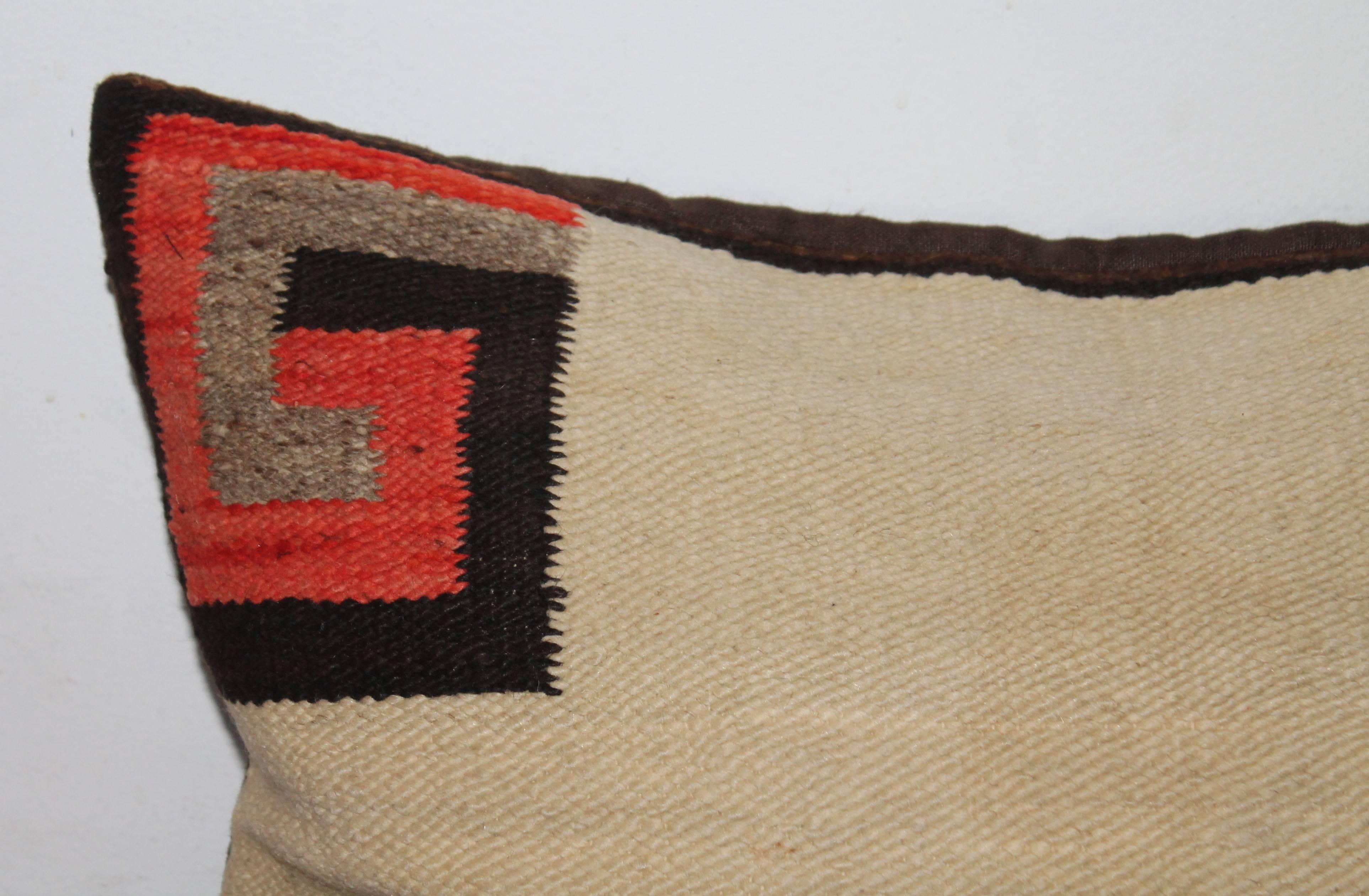 This transitional Navajo saddle blanket weaving is in good condition has a brown cotton linen backing. This is the entire saddle blanket. A fine early example of a saddle blanket. The backing is in brown cotton linen.