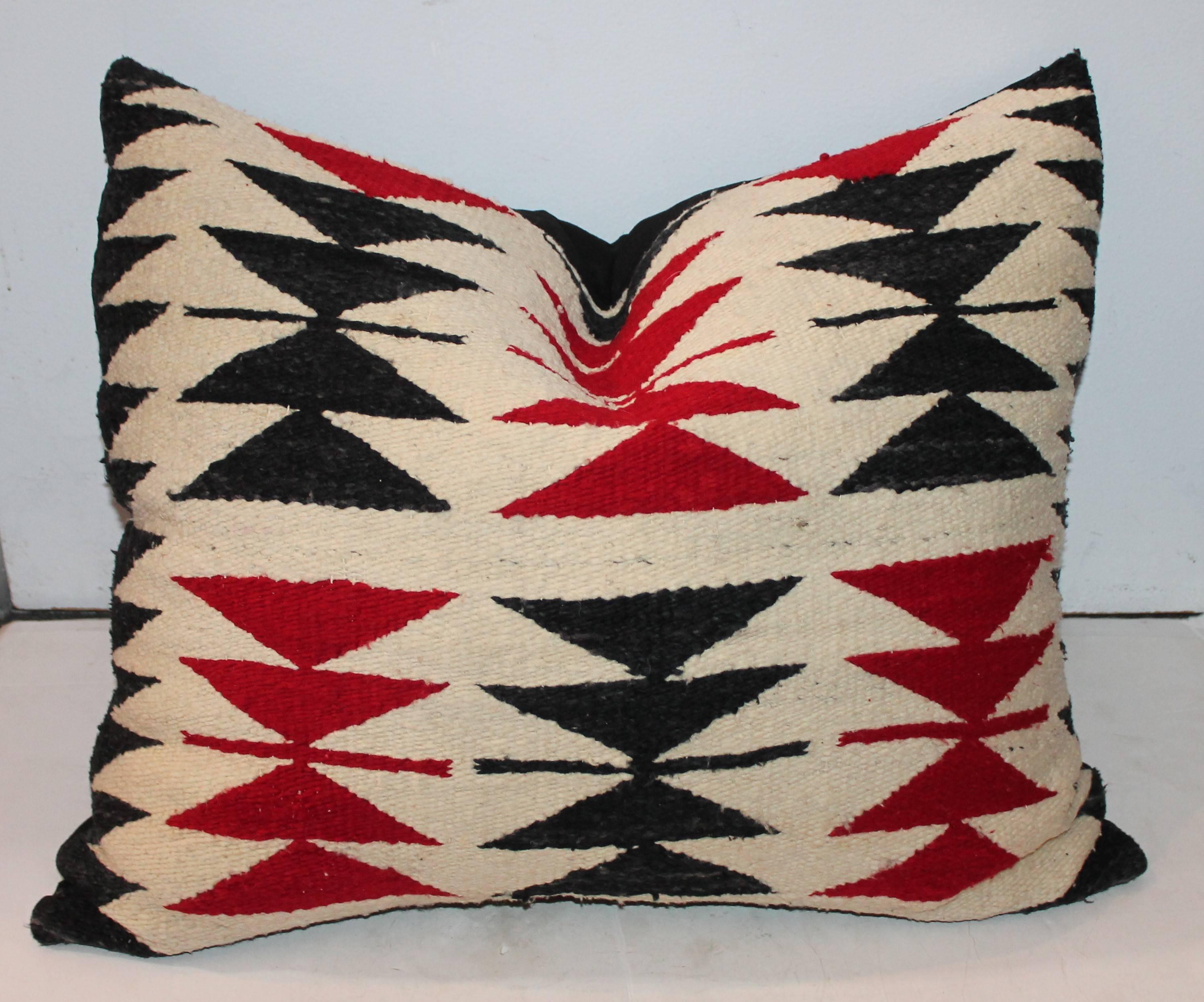 This amazing Navajo flying geese patter pillows is in amazing condition. Black and red are the most sought out colors when it comes to collecting Navajo. This pillow has a zipper enclosure with a down and feather insert. This item has been